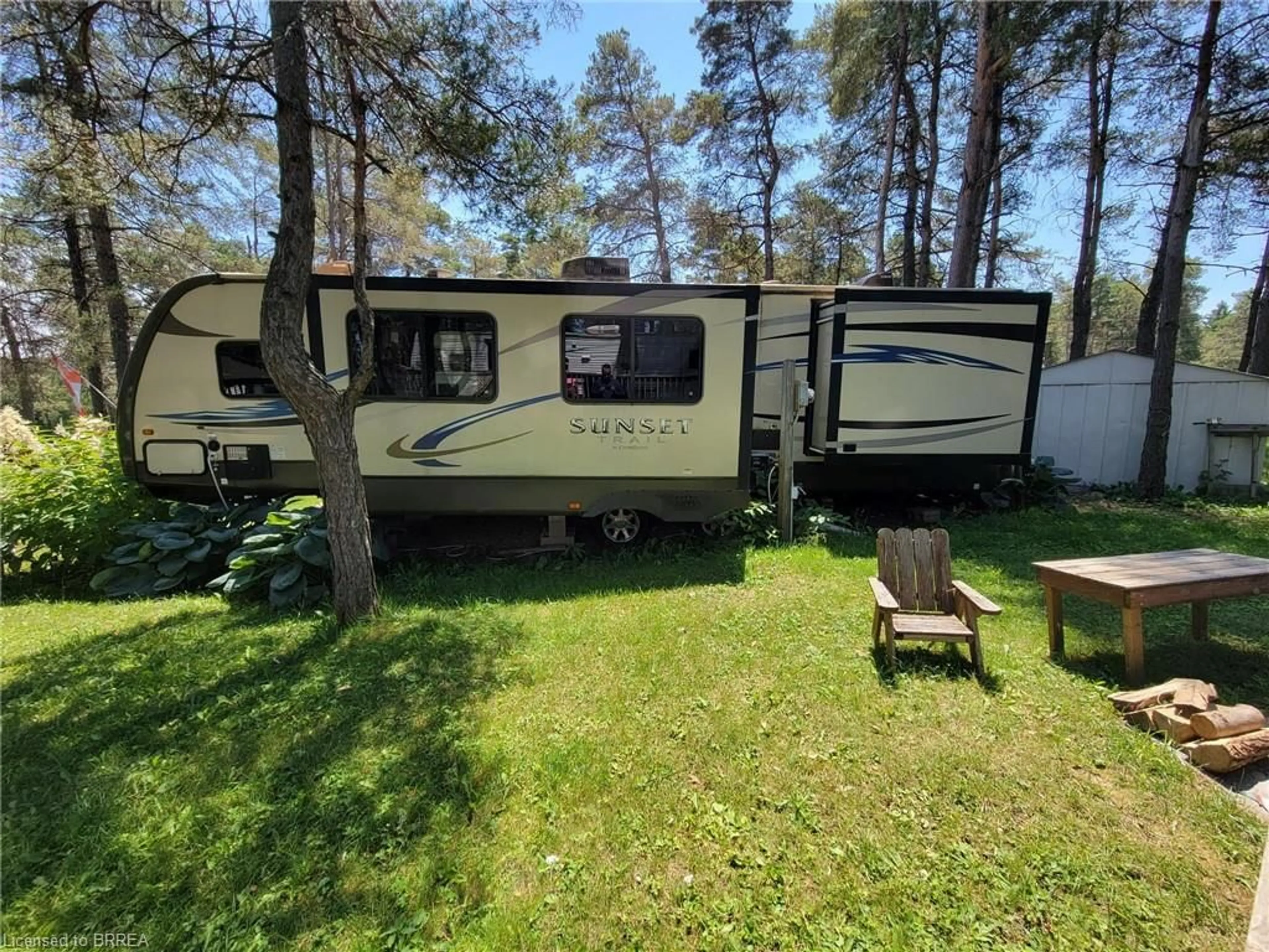 A pic from outside/outdoor area/front of a property/back of a property/a pic from drone, forest/trees view for 8772 Concession 9 Rd #135, Moorefield Ontario N0G 2K0