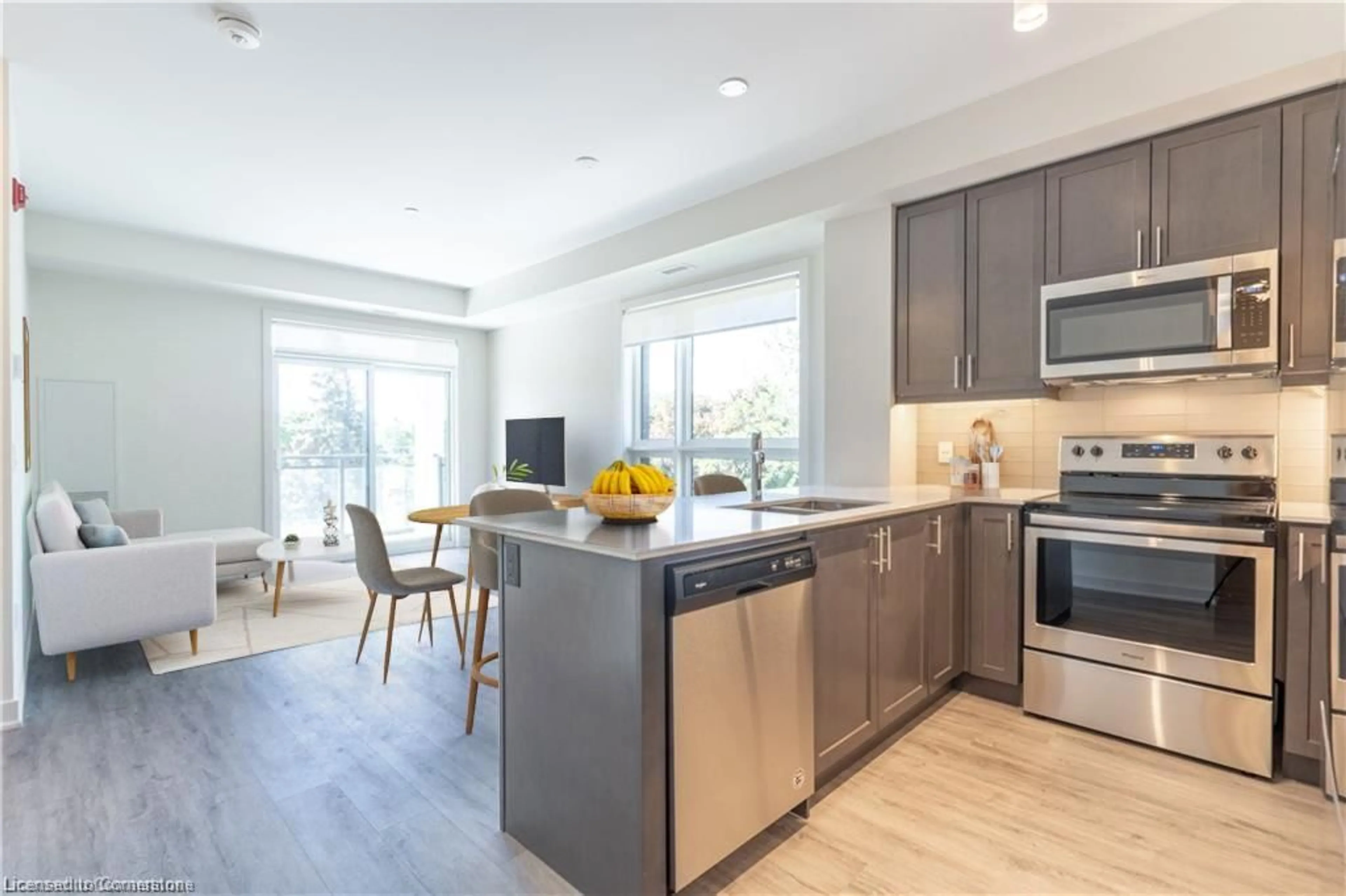 Open concept kitchen, wood/laminate floor for 320 Plains Rd #306, Burlington Ontario L7T 0C1