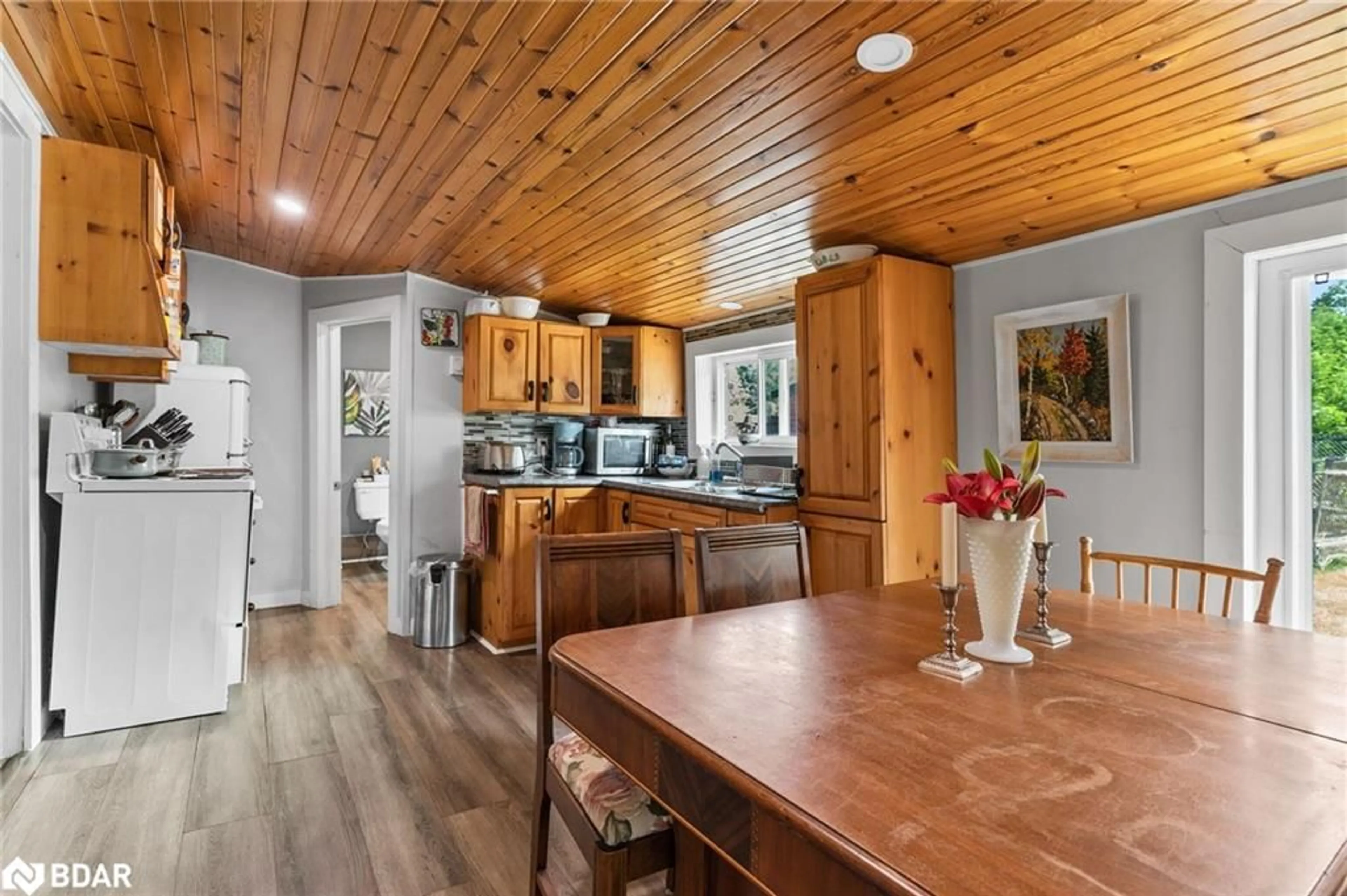 Open concept kitchen, wood/laminate floor for 322 Bobcaygeon Rd, Minden Ontario K0M 2K0