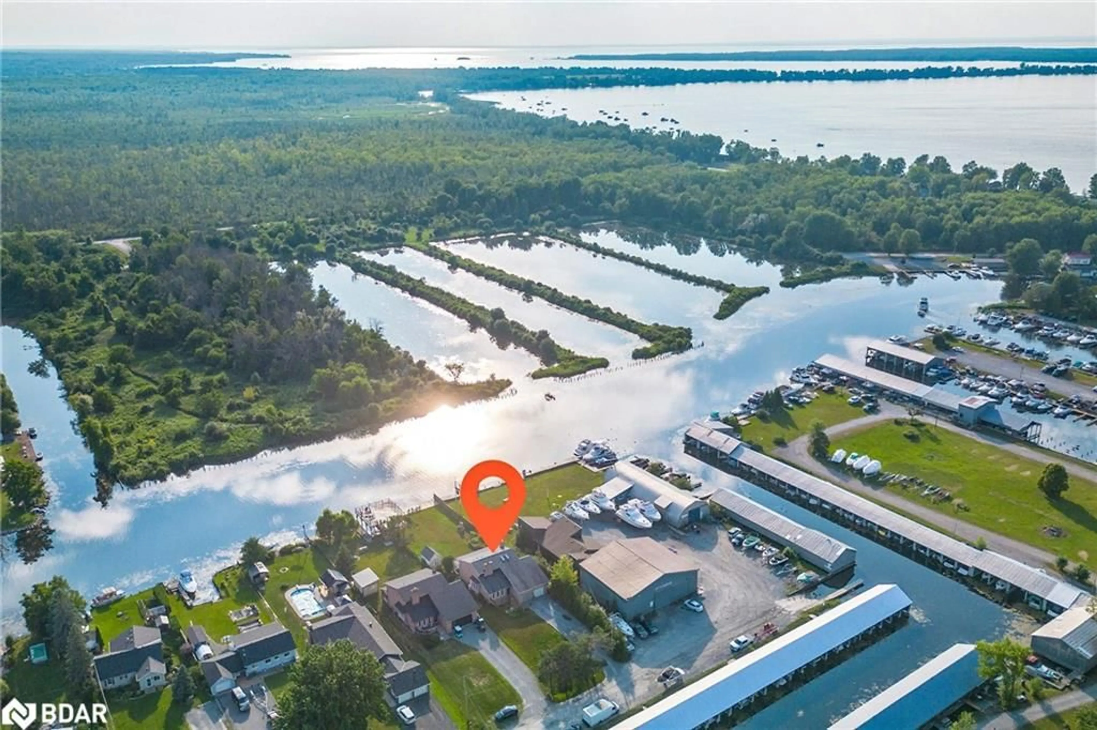 A pic from outside/outdoor area/front of a property/back of a property/a pic from drone, water/lake/river/ocean view for 52 Riverside Drive, Georgina Ontario L0E 1N0