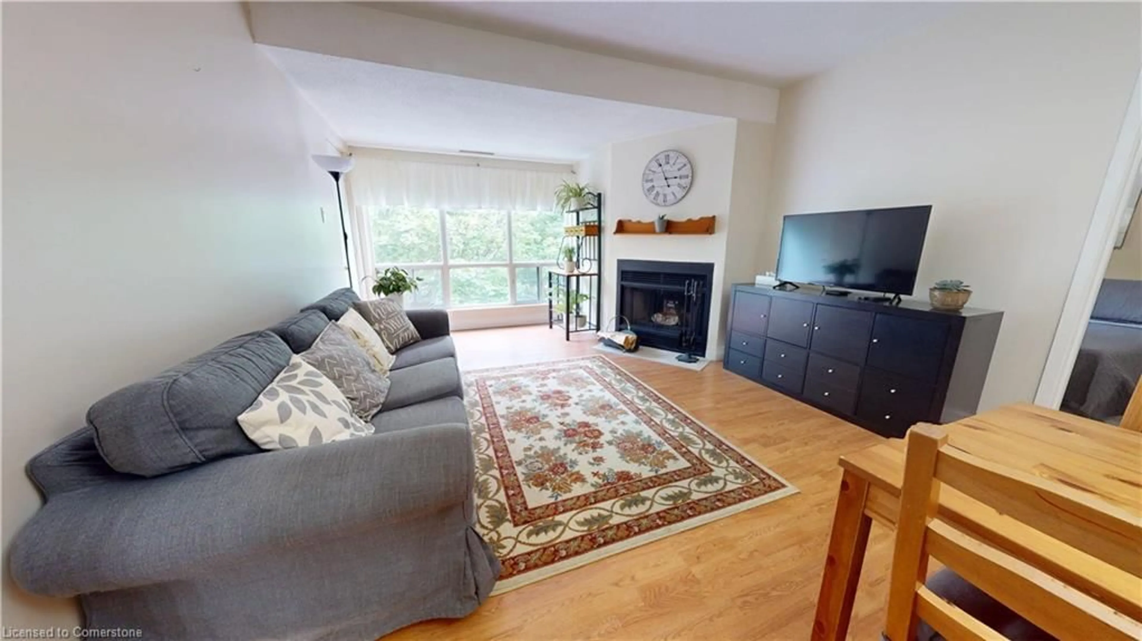 Living room with furniture, wood/laminate floor for 15 Hofstetter Ave #403, Kitchener Ontario N2A 3Z7