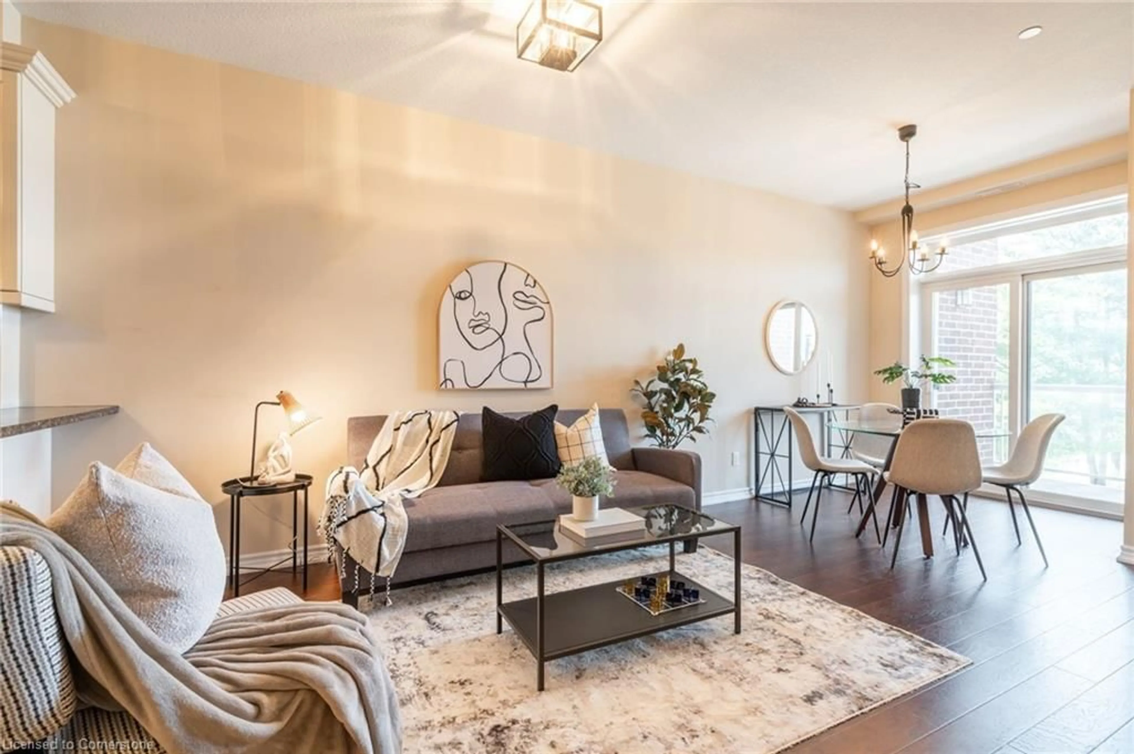 Living room with furniture, wood/laminate floor for 95 Wilson St #212, Hamilton Ontario L8L 5C4