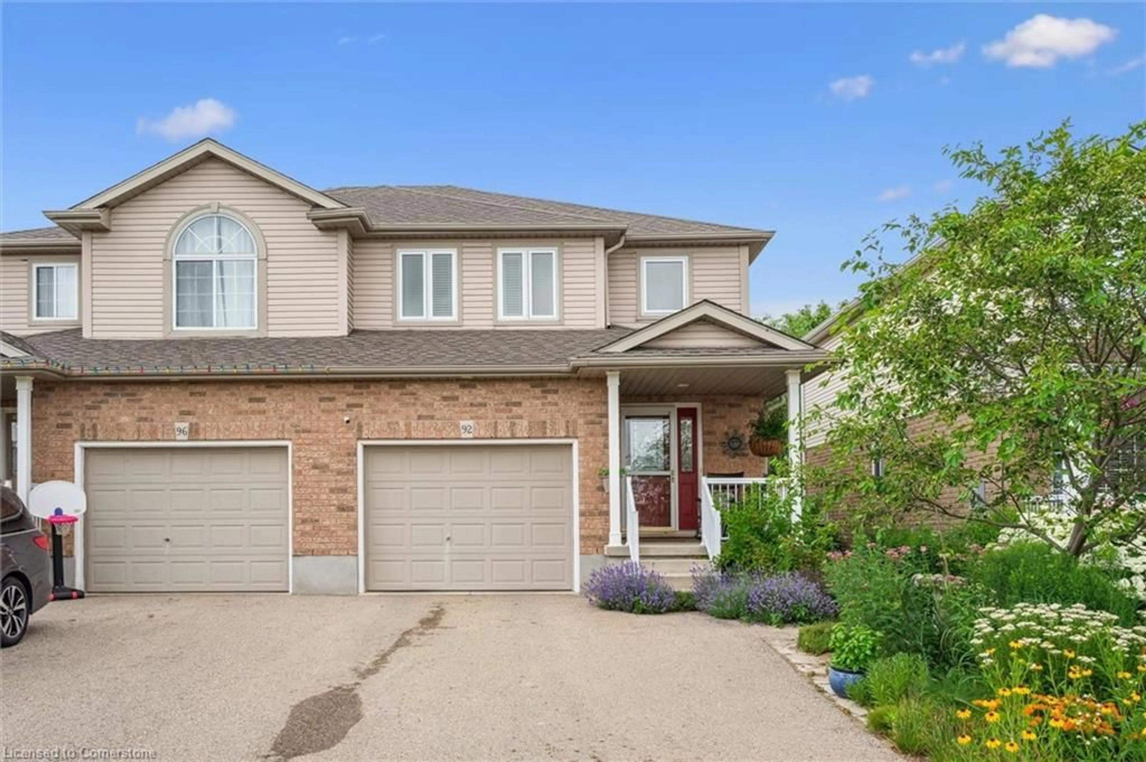 Home with brick exterior material, street for 92 Raising Mill Gate, Elmira Ontario N3B 3N7