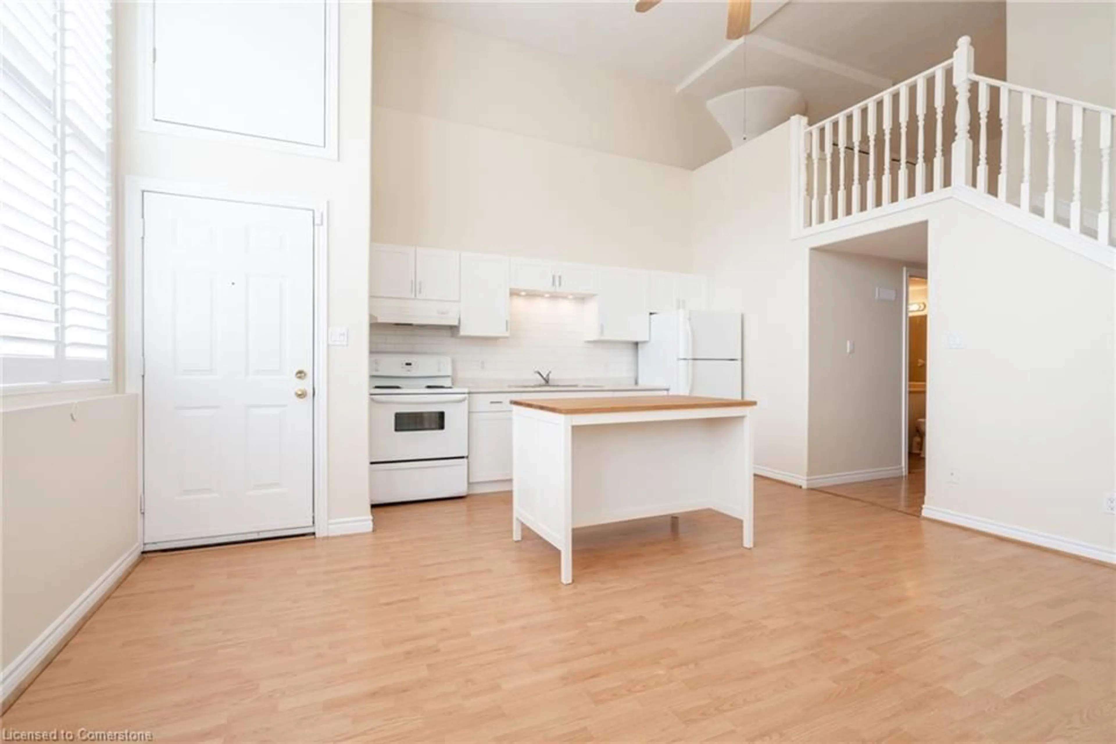Open concept kitchen, wood/laminate floor for 111 Grey St #102, Brantford Ontario N3S 4V8