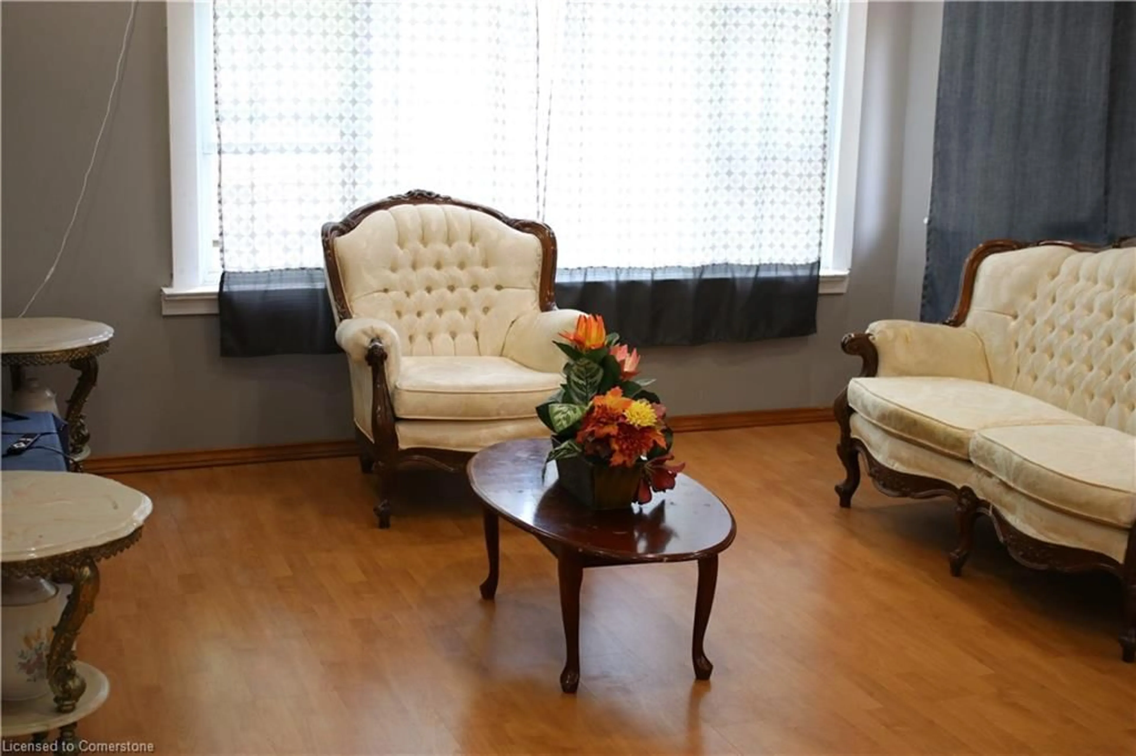 Living room with furniture, wood/laminate floor for 665 Lakeshore Rd, Sarnia Ontario N7V 2T1