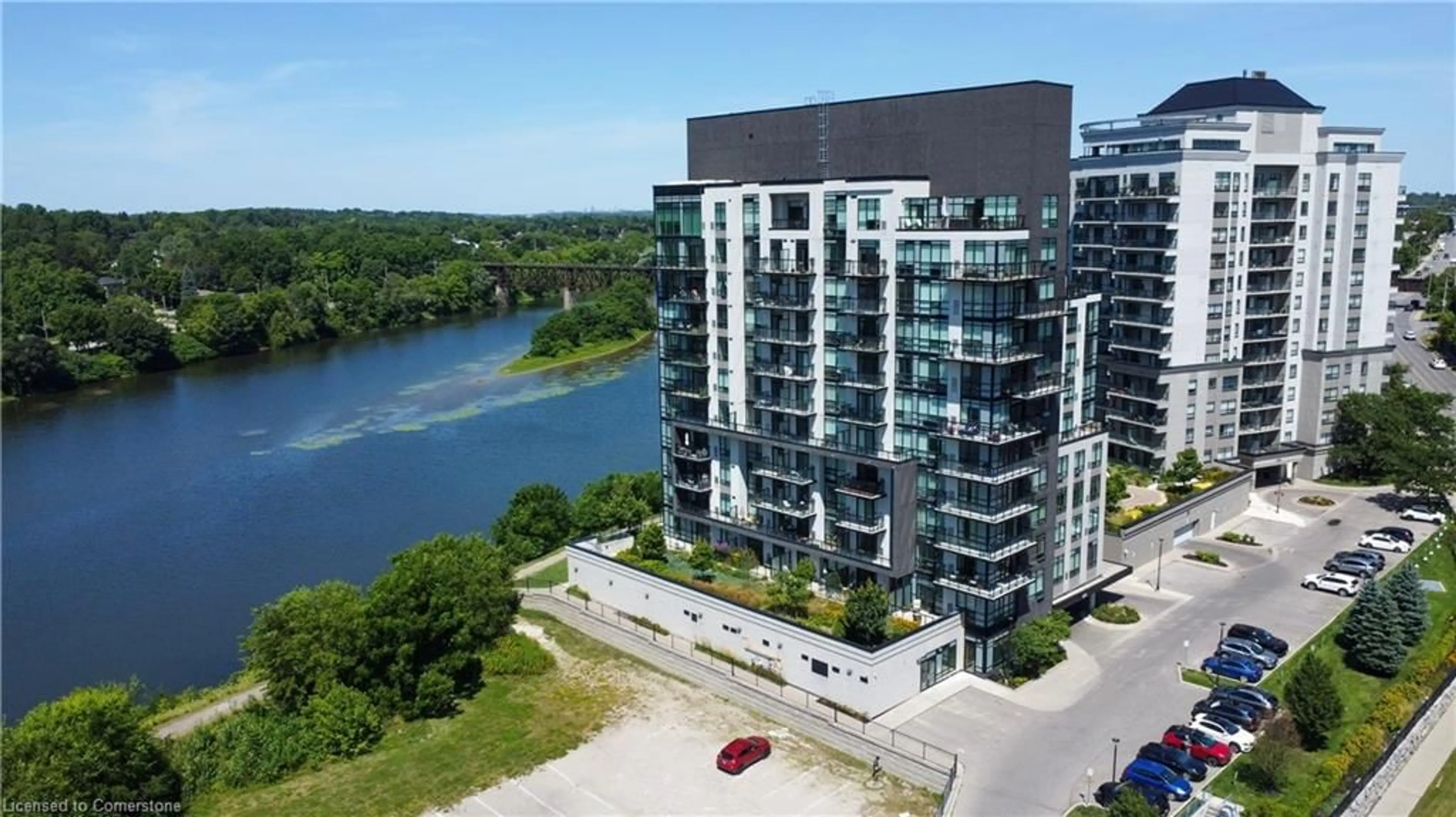 A pic from outside/outdoor area/front of a property/back of a property/a pic from drone, water/lake/river/ocean view for 150 Water Street North St #1007, Cambridge Ontario N1R 0B5