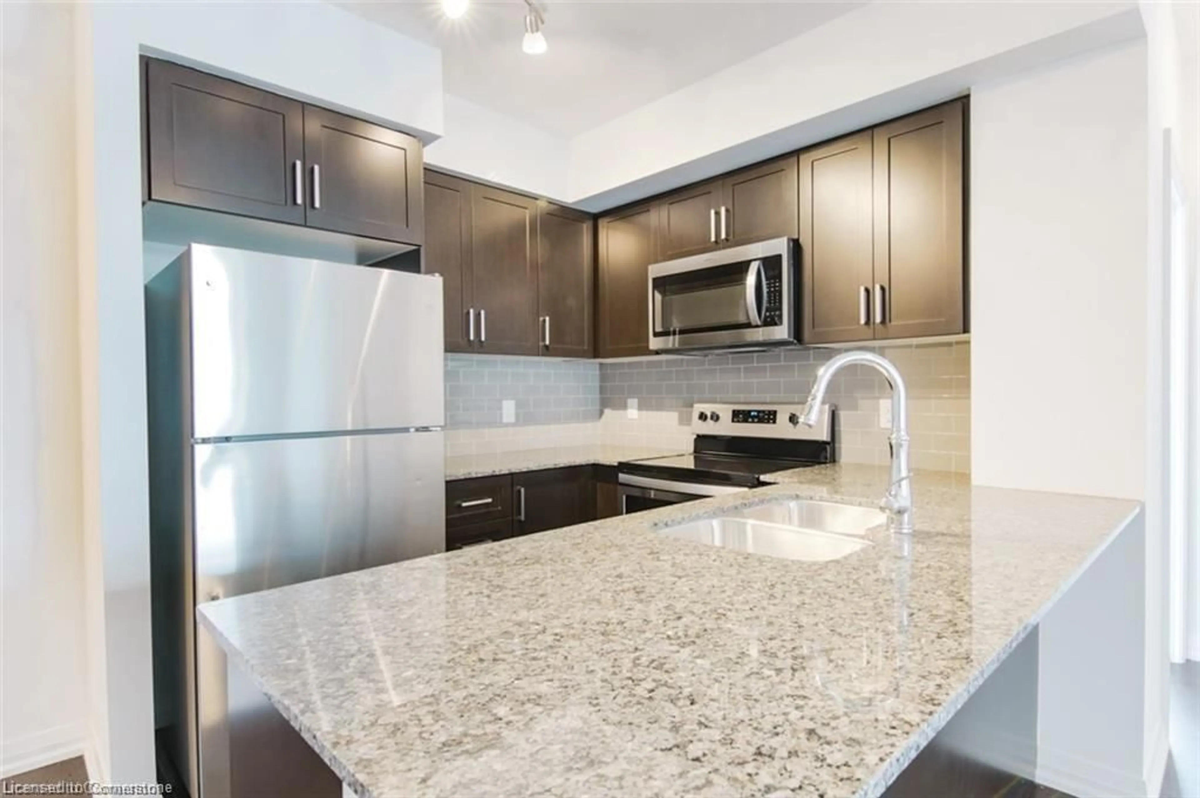 Open concept kitchen, ceramic/tile floor for 155 Caroline St #402, Waterloo Ontario N2L 0J8