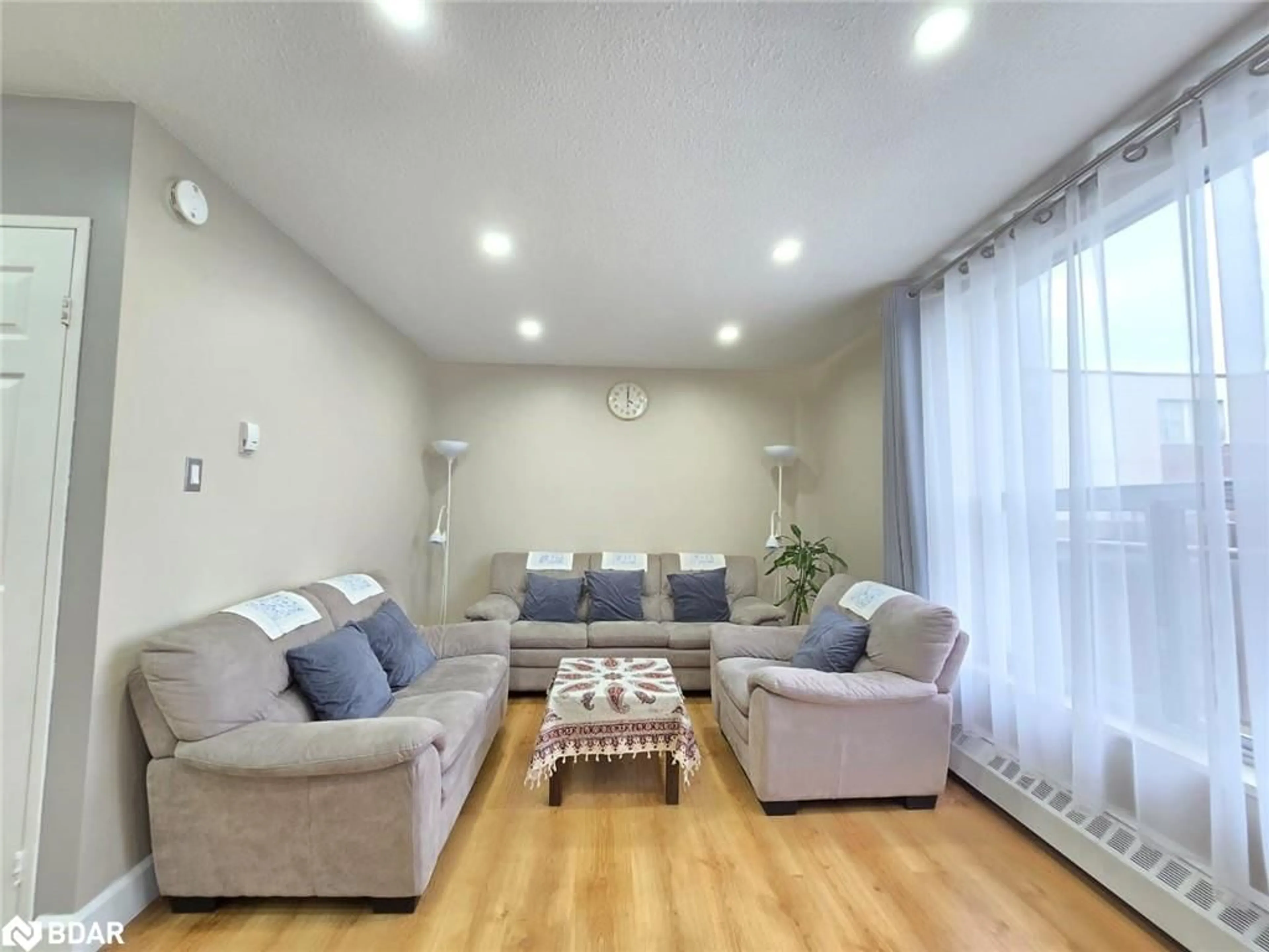 Living room with furniture, unknown for 1055A Forestwood Dr, Erindale Ontario L5C 2T8