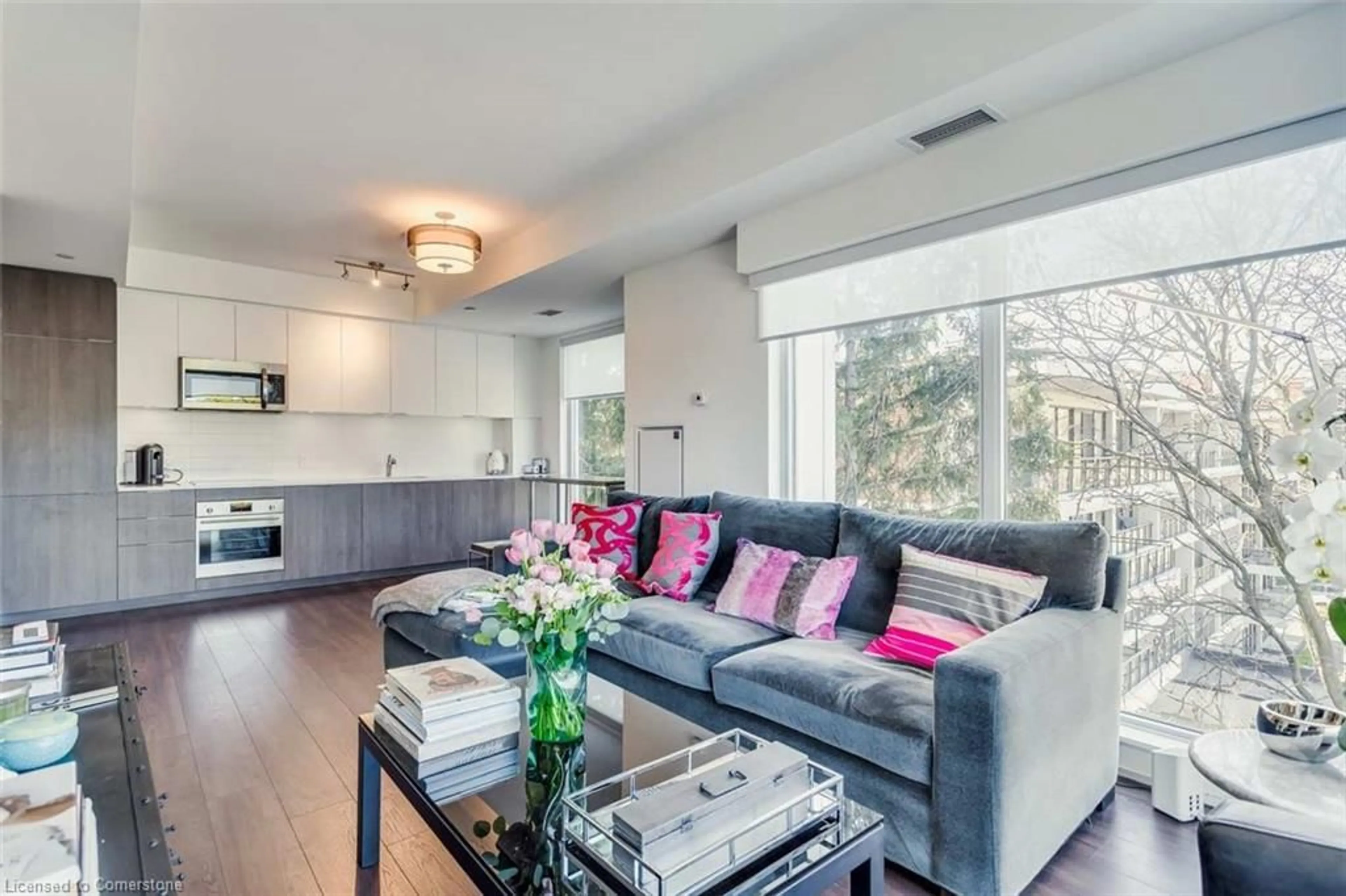 Living room with furniture, wood/laminate floor for 223 St Clair Ave #406, Toronto Ontario M4V 1R3