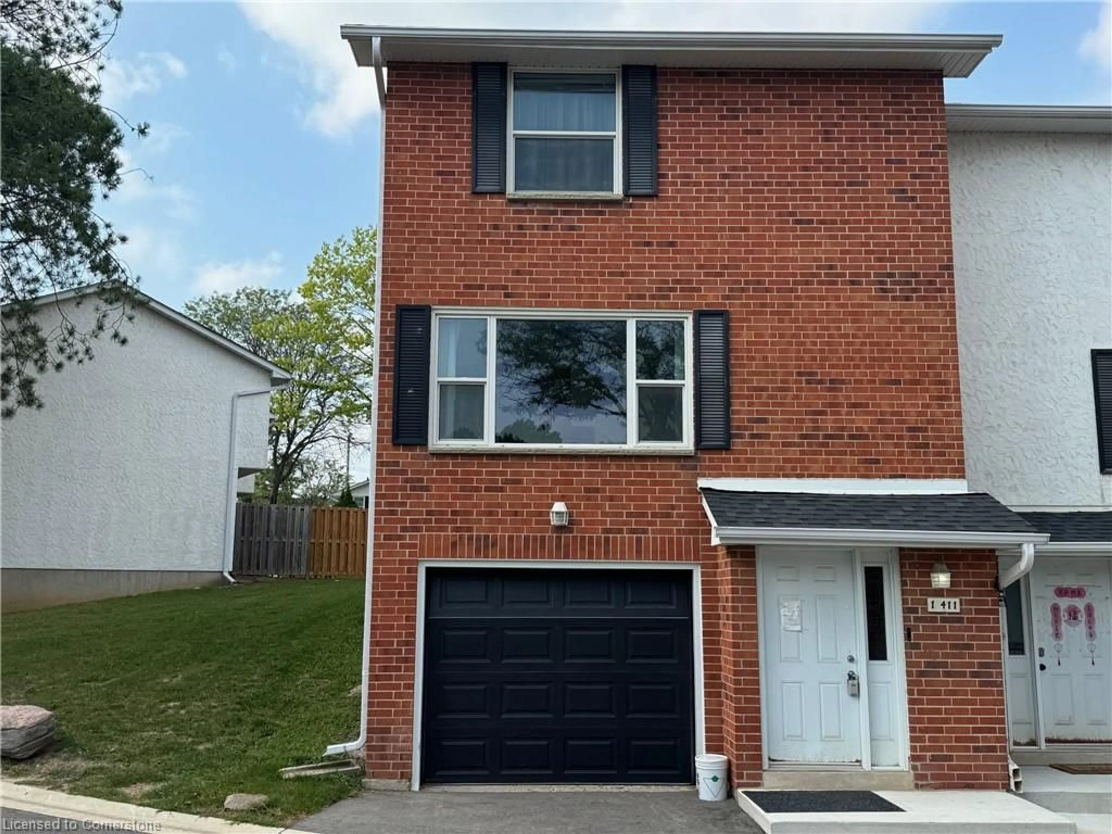 Home with brick exterior material, street for 411 Keats Way #1, Waterloo Ontario N2L 5S7
