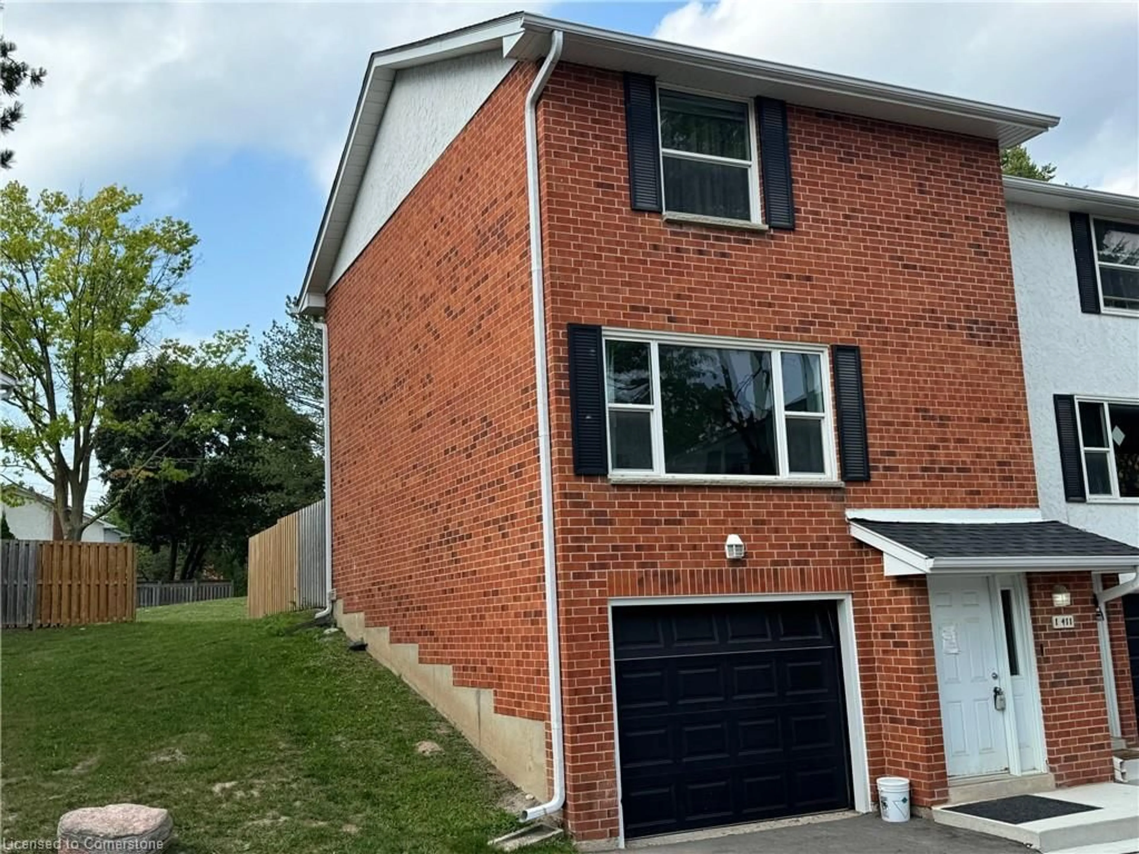 Home with brick exterior material, street for 411 Keats Way #1, Waterloo Ontario N2L 5S7