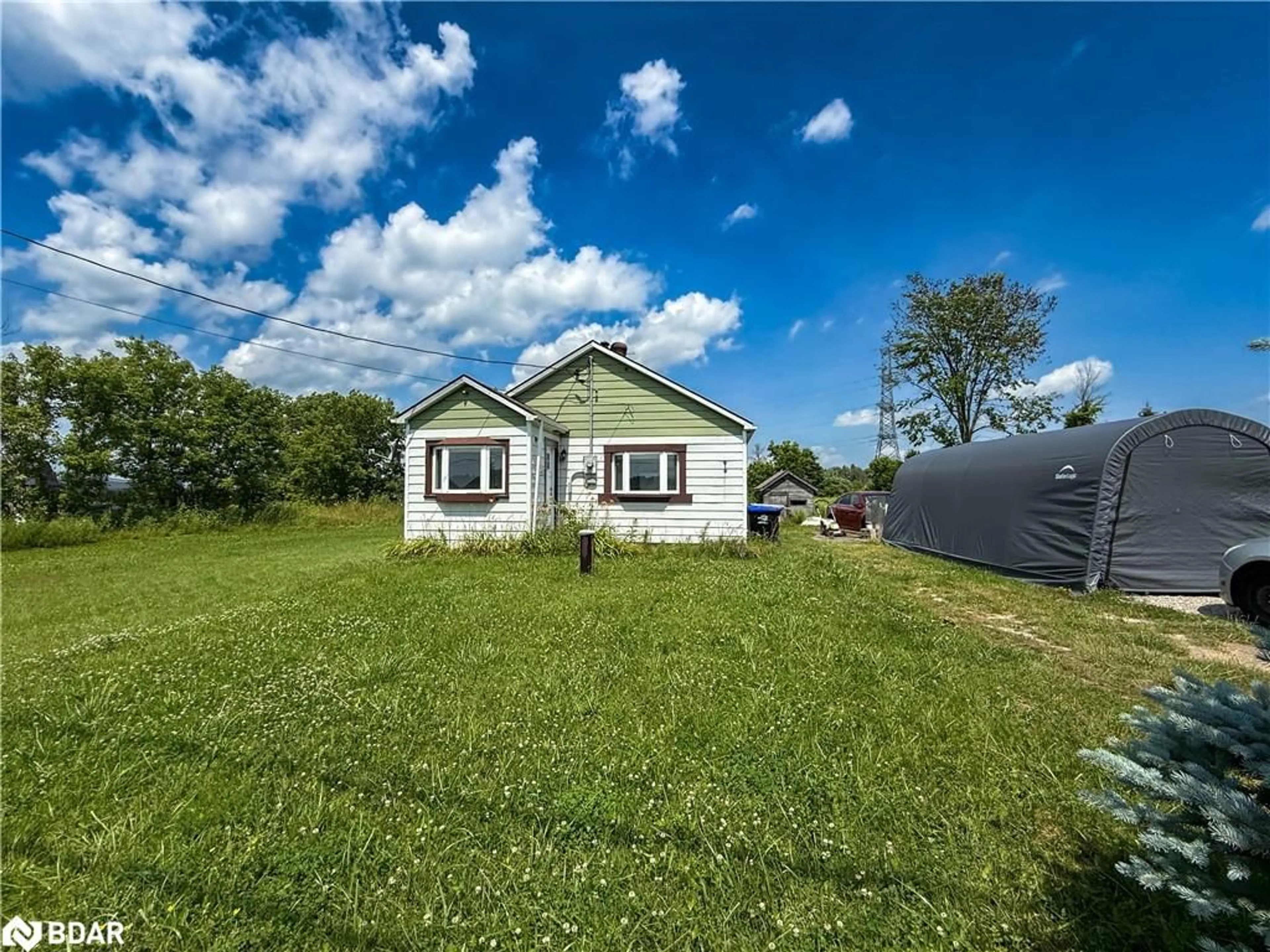 A pic from outside/outdoor area/front of a property/back of a property/a pic from drone, unknown for 6170 90 County Rd, Essa Ontario L0M 1B4