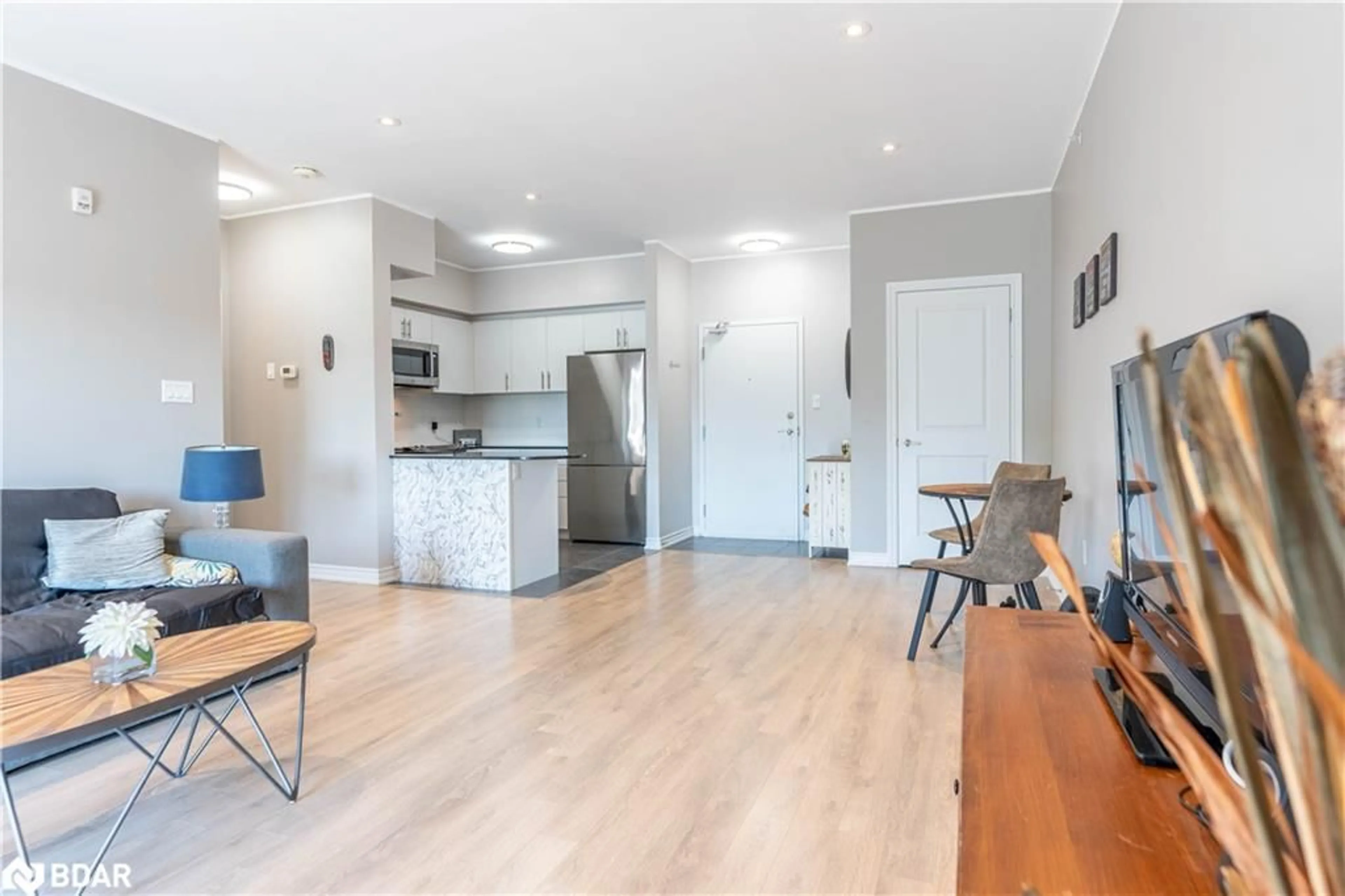 Open concept kitchen, wood/laminate floor for 7 Greenwich St #403, Barrie Ontario L4N 7R1