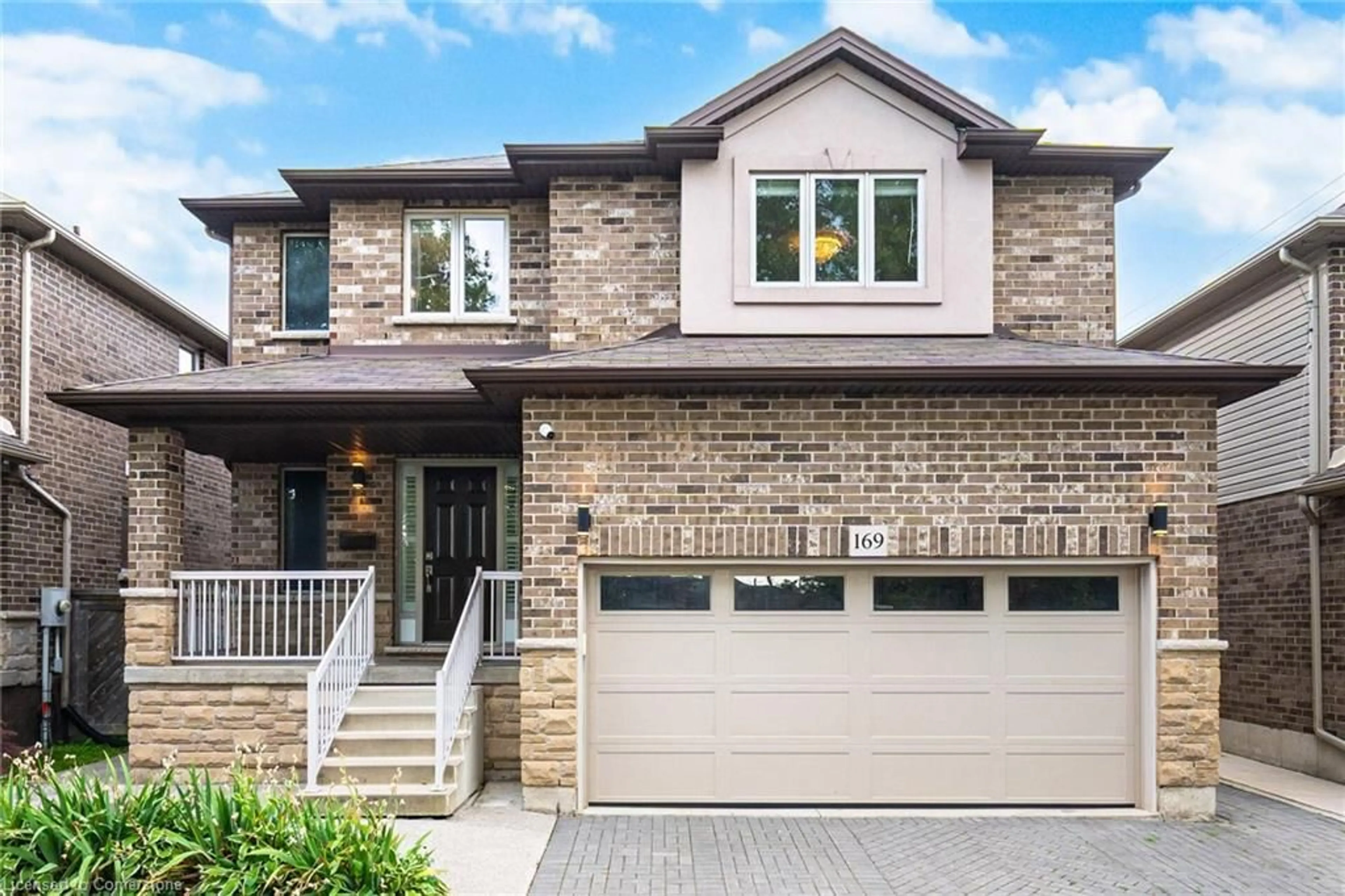 Home with brick exterior material, street for 169 East 8th St, Hamilton Ontario L9A 4Y7
