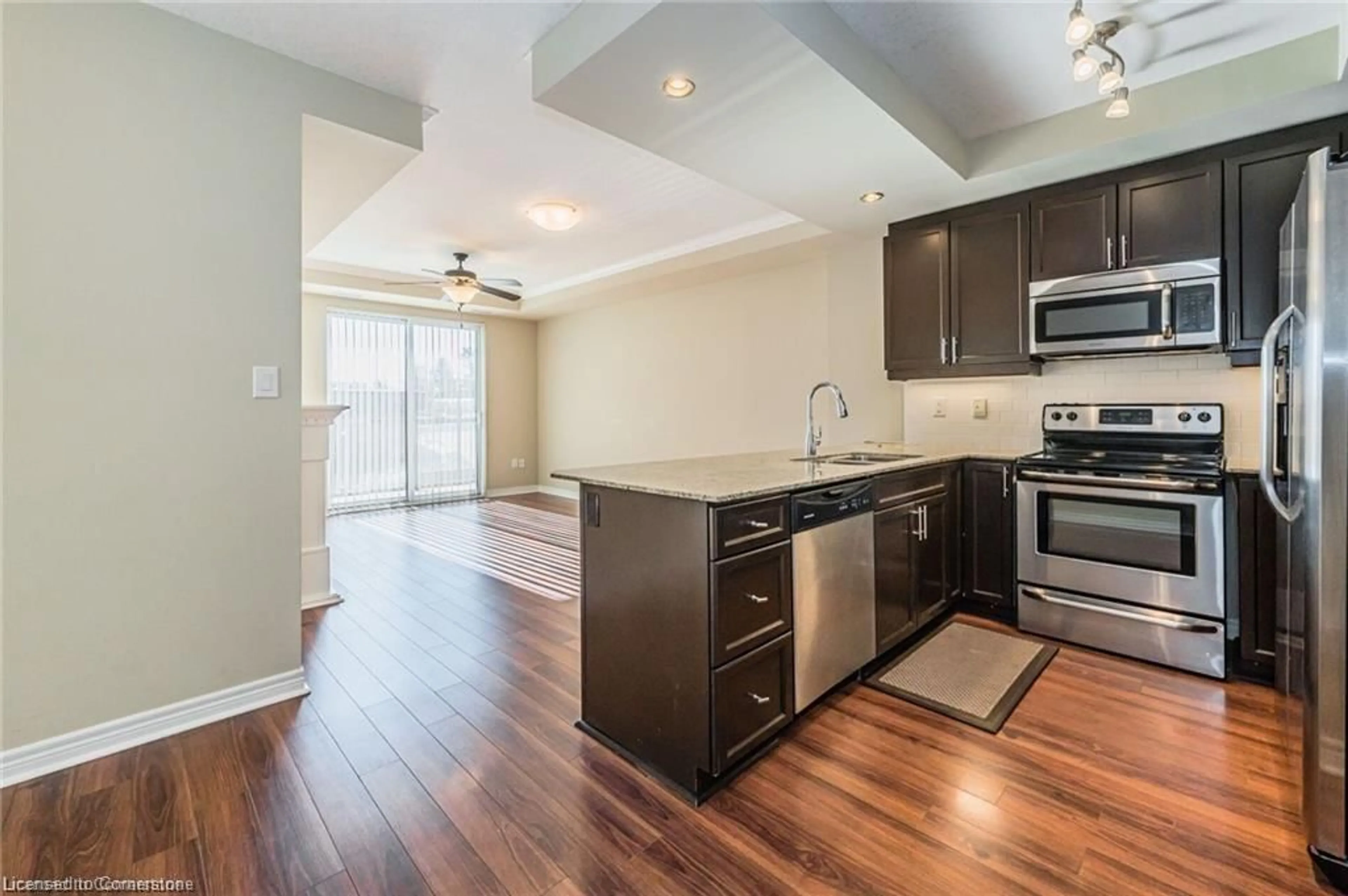 Open concept kitchen, wood/laminate floor for 539 Belmont Ave #210, Kitchener Ontario N2M 0A2