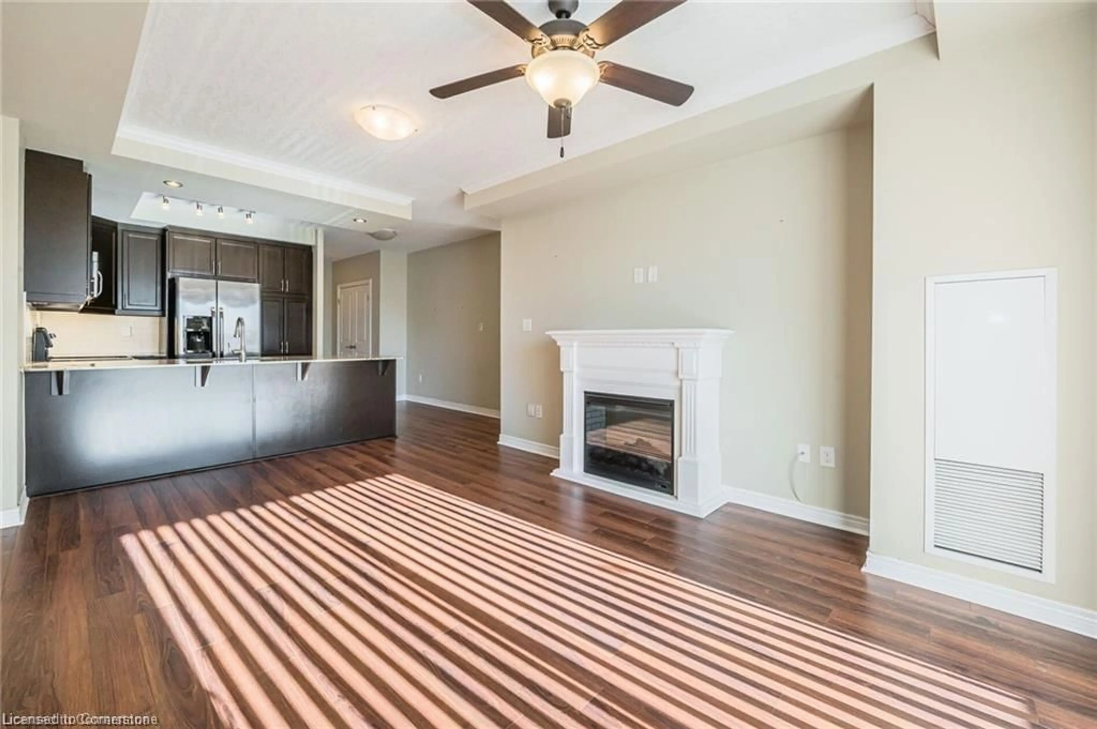 Living room with furniture, wood/laminate floor for 539 Belmont Ave #210, Kitchener Ontario N2M 0A2