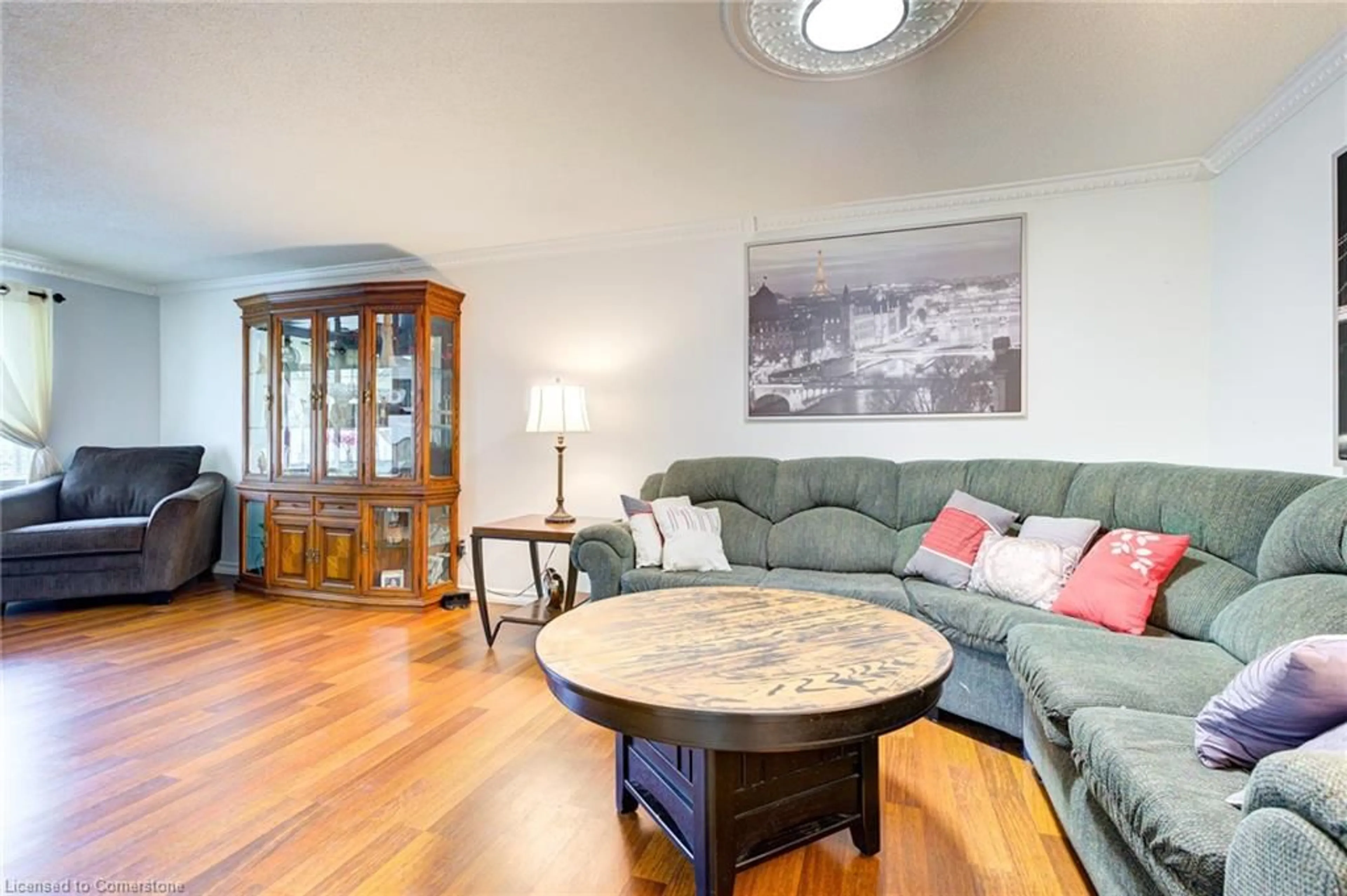 Living room with furniture, wood/laminate floor for 85 Frobisher Crt, Cambridge Ontario N1R 6Z5