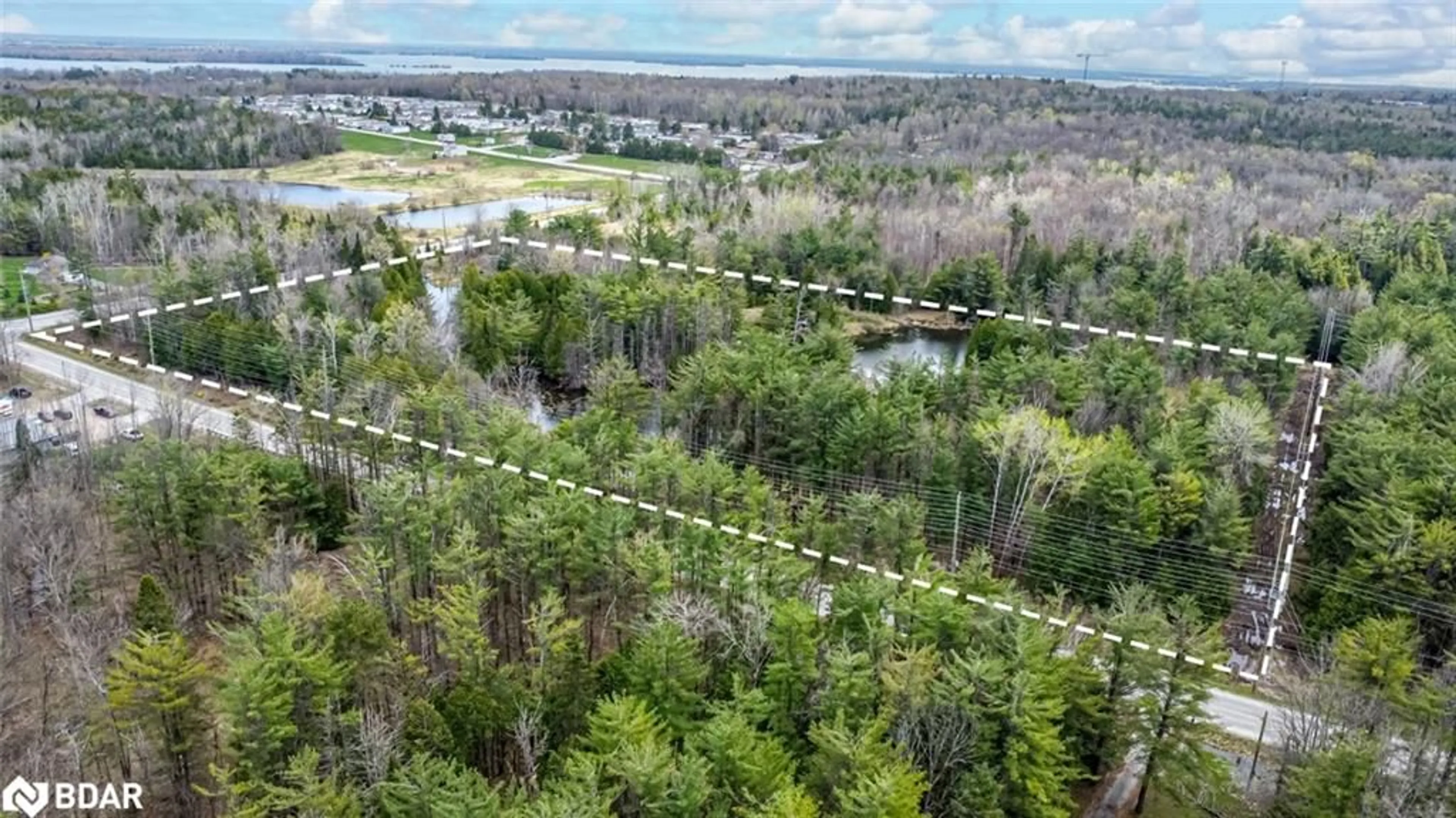 A pic from outside/outdoor area/front of a property/back of a property/a pic from drone, forest/trees view for 4016 Carlyon Line, Severn Ontario L3V 0W8