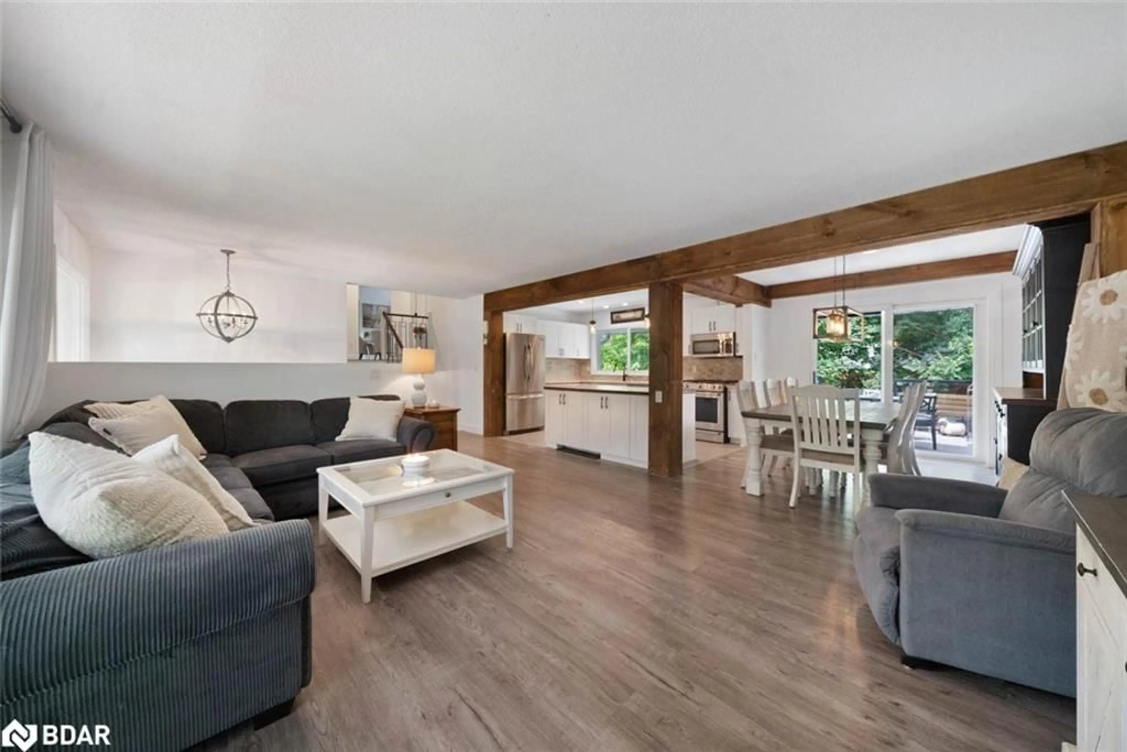 Living room with furniture, wood/laminate floor for 2 Noraline Ave, Midhurst Ontario L0L 1X1