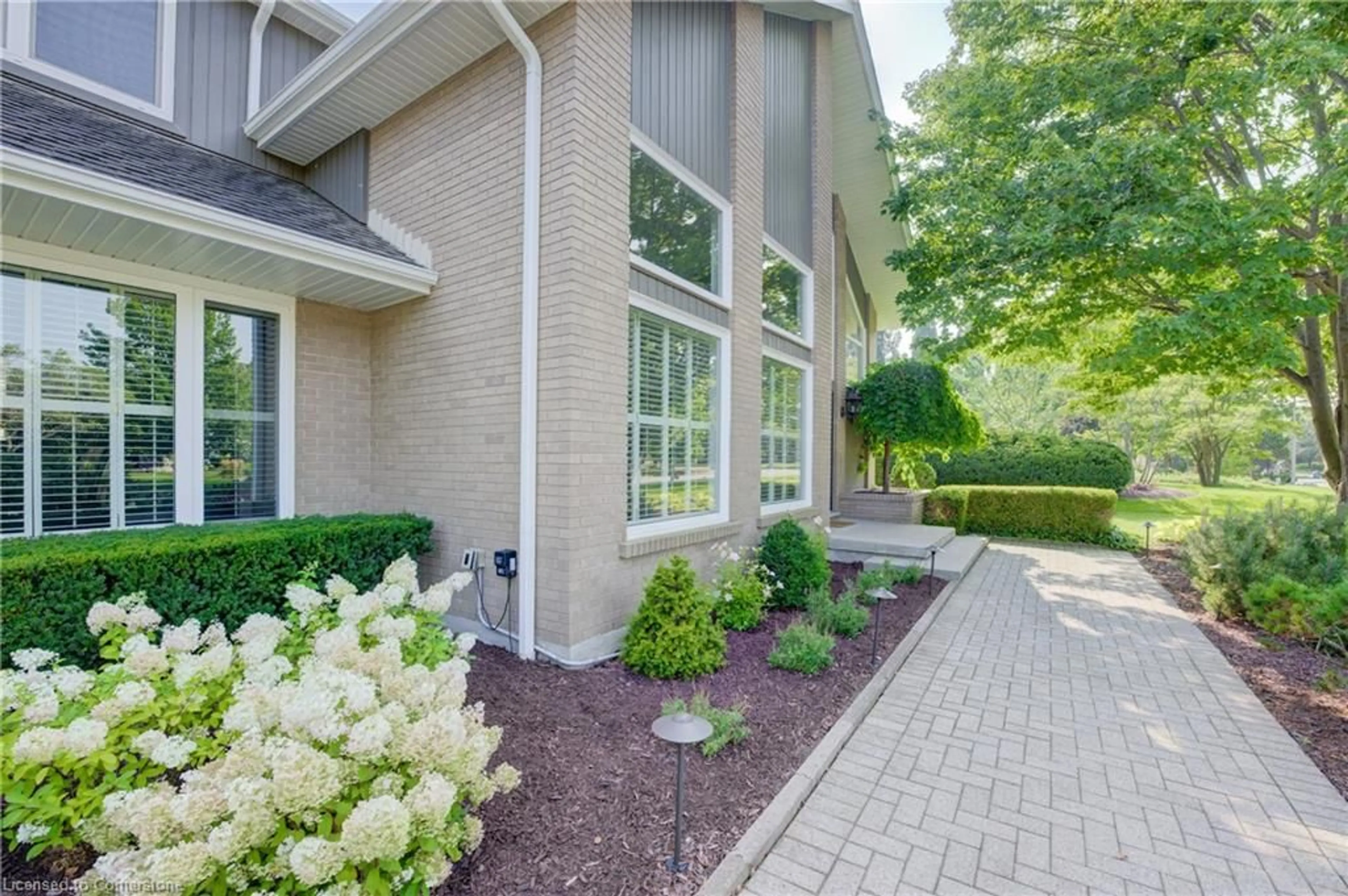 Home with brick exterior material, street for 587 Manorwood Crt, Waterloo Ontario N2K 3L7