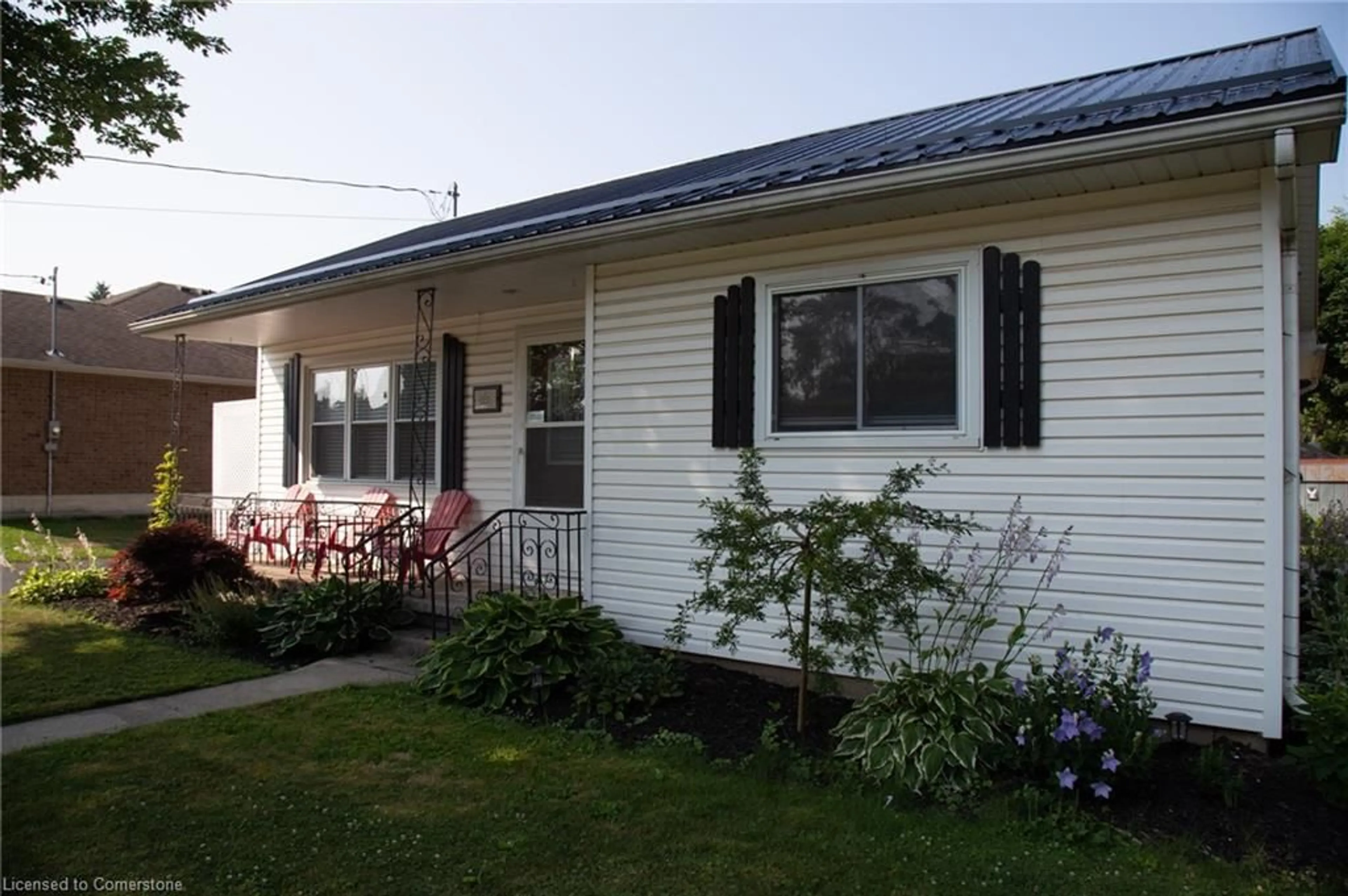 Home with vinyl exterior material, street for 831 Main St, Port Dover Ontario N0A 1N0