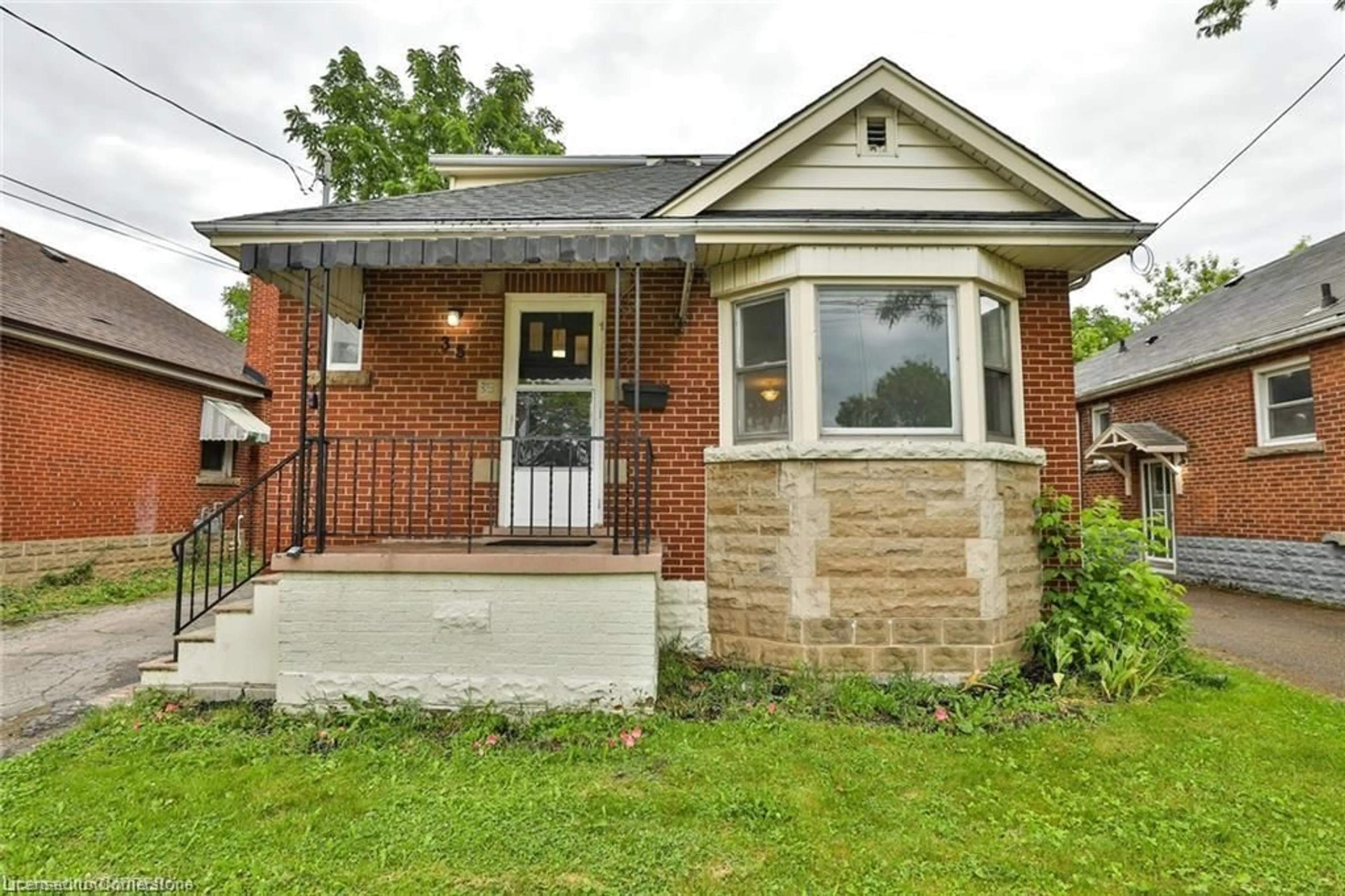 Home with brick exterior material, street for 35 West 3rd St, Hamilton Ontario L9C 3J8