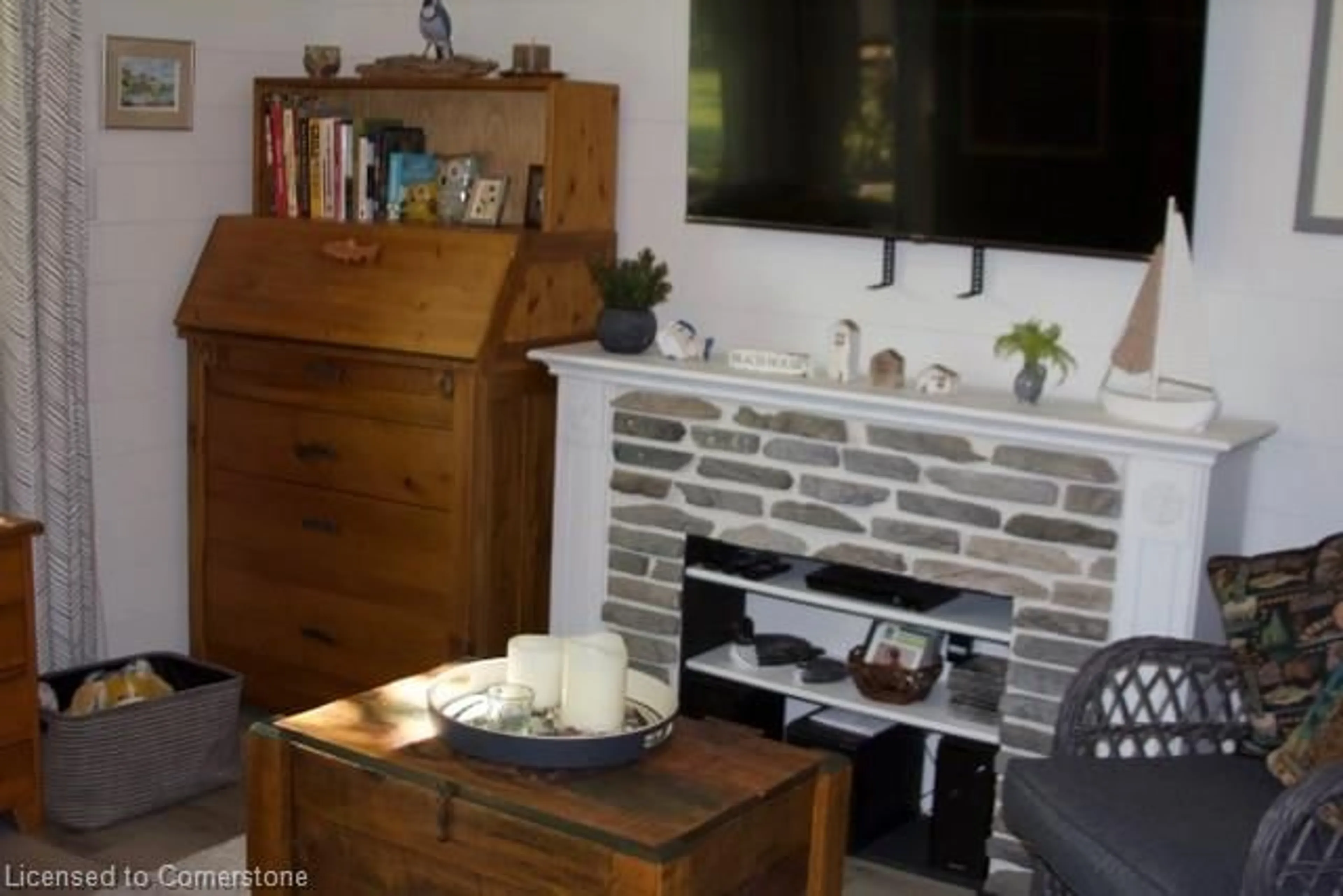 Living room with furniture, wood/laminate floor for 207 St. George St #53 Bucks Park, Port Dover Ontario N0A 1N0