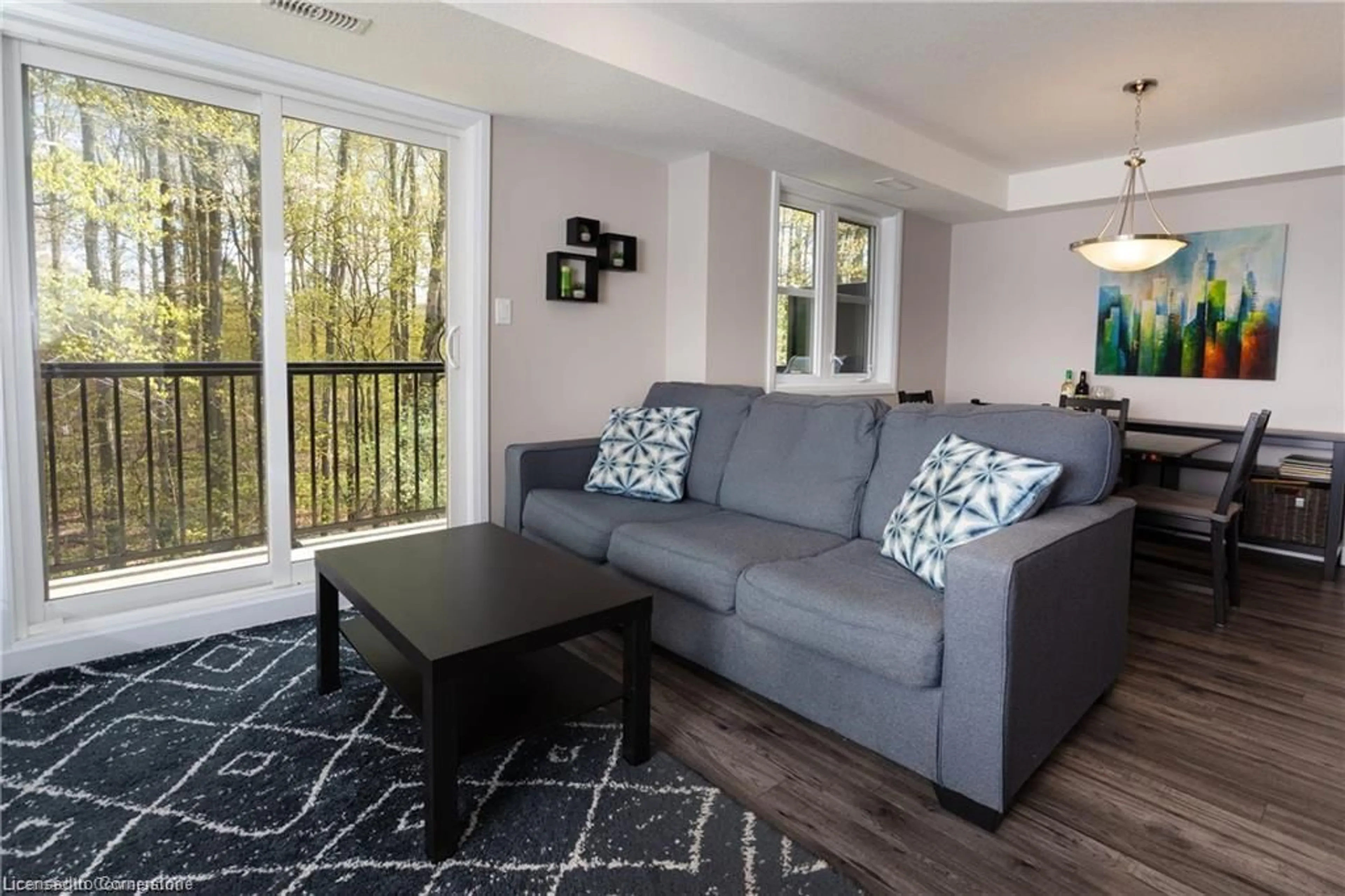Living room with furniture, wood/laminate floor for 1989 Ottawa St #29D, Kitchener Ontario N2E 0G7
