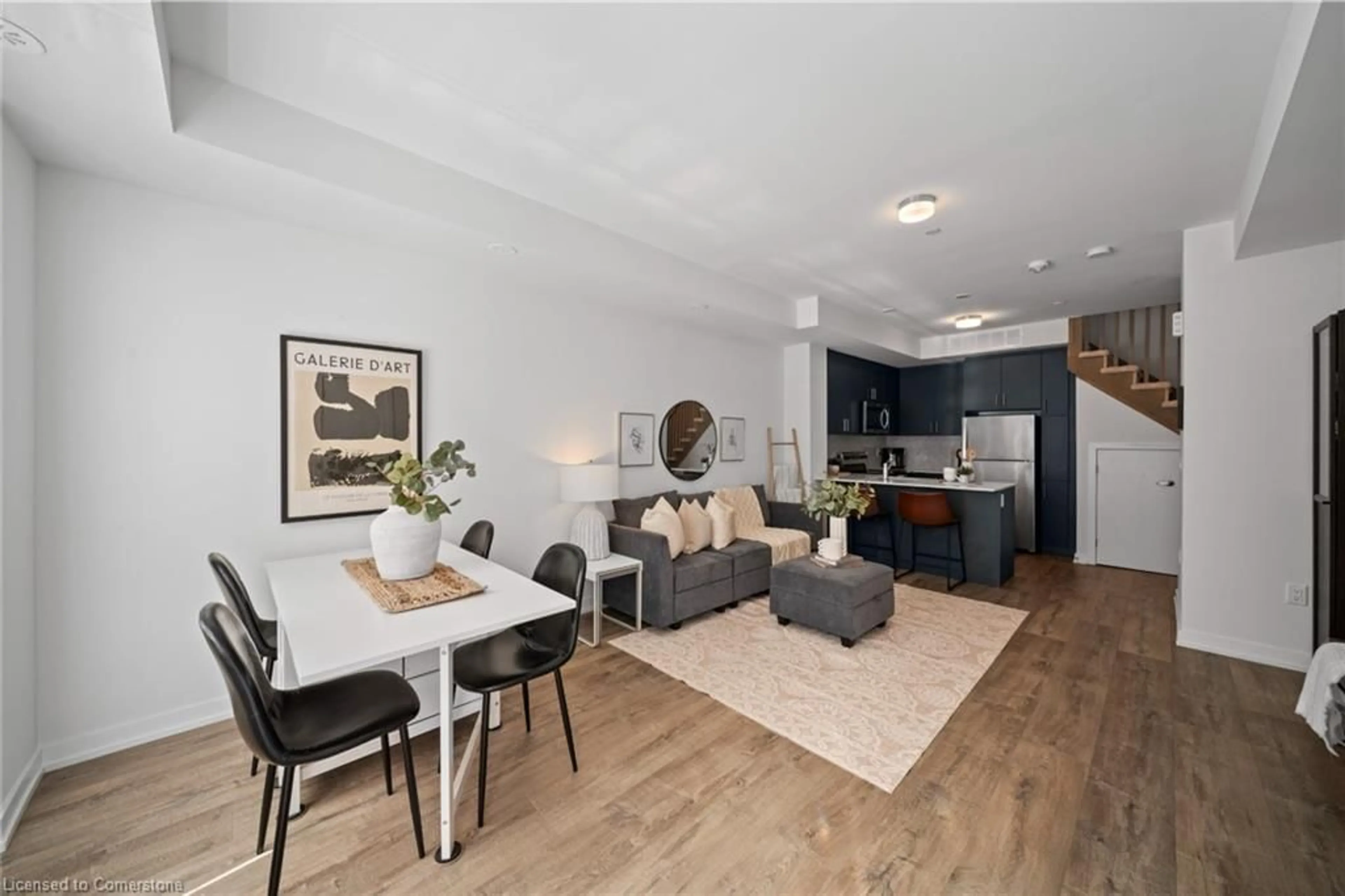 Living room with furniture, wood/laminate floor for 3546 Colonial Drive #10, Mississauga Ontario L5L 0C1