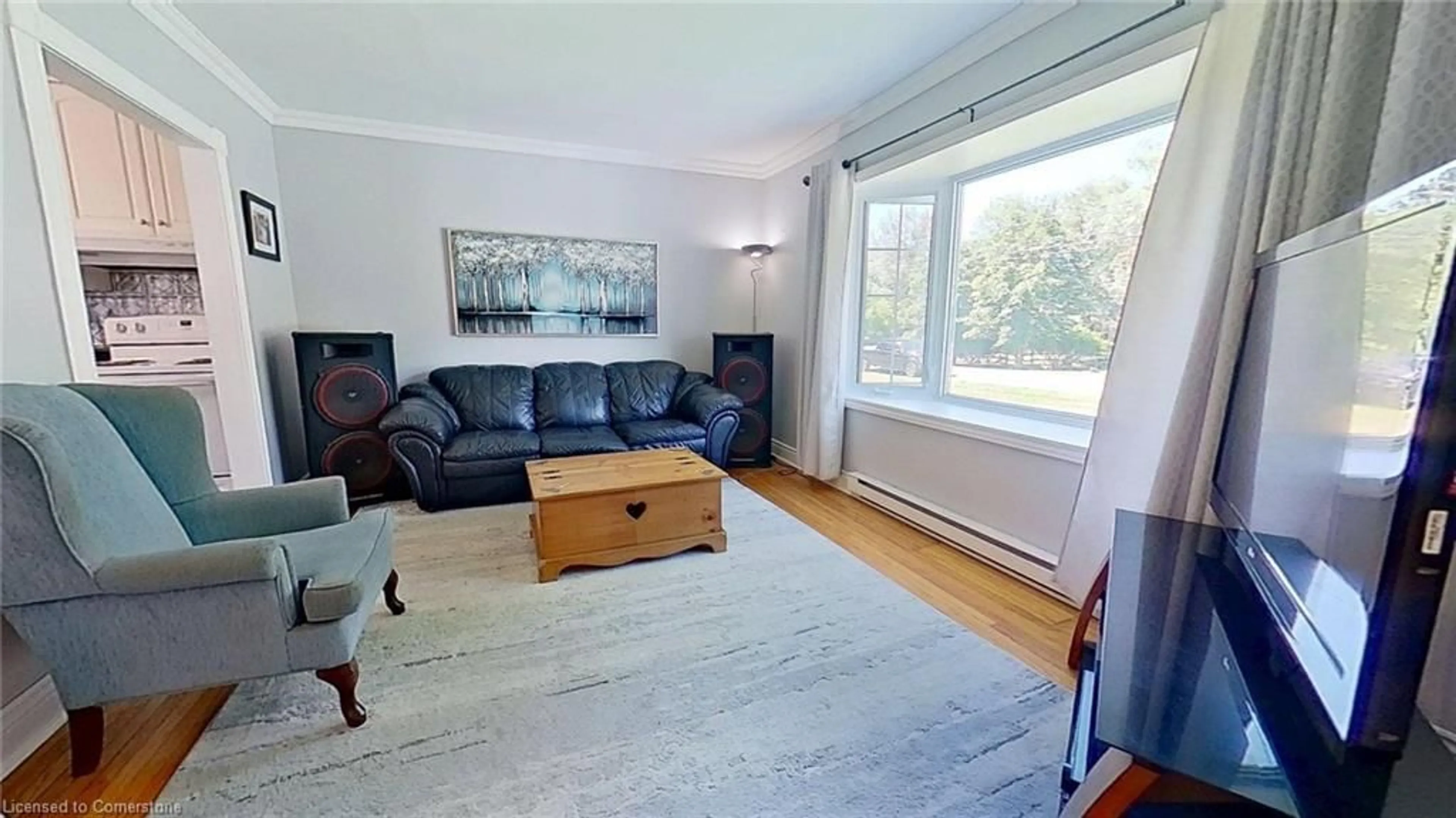 Living room with furniture, wood/laminate floor for 22 Brook Rd, Cobourg Ontario K9A 4G1