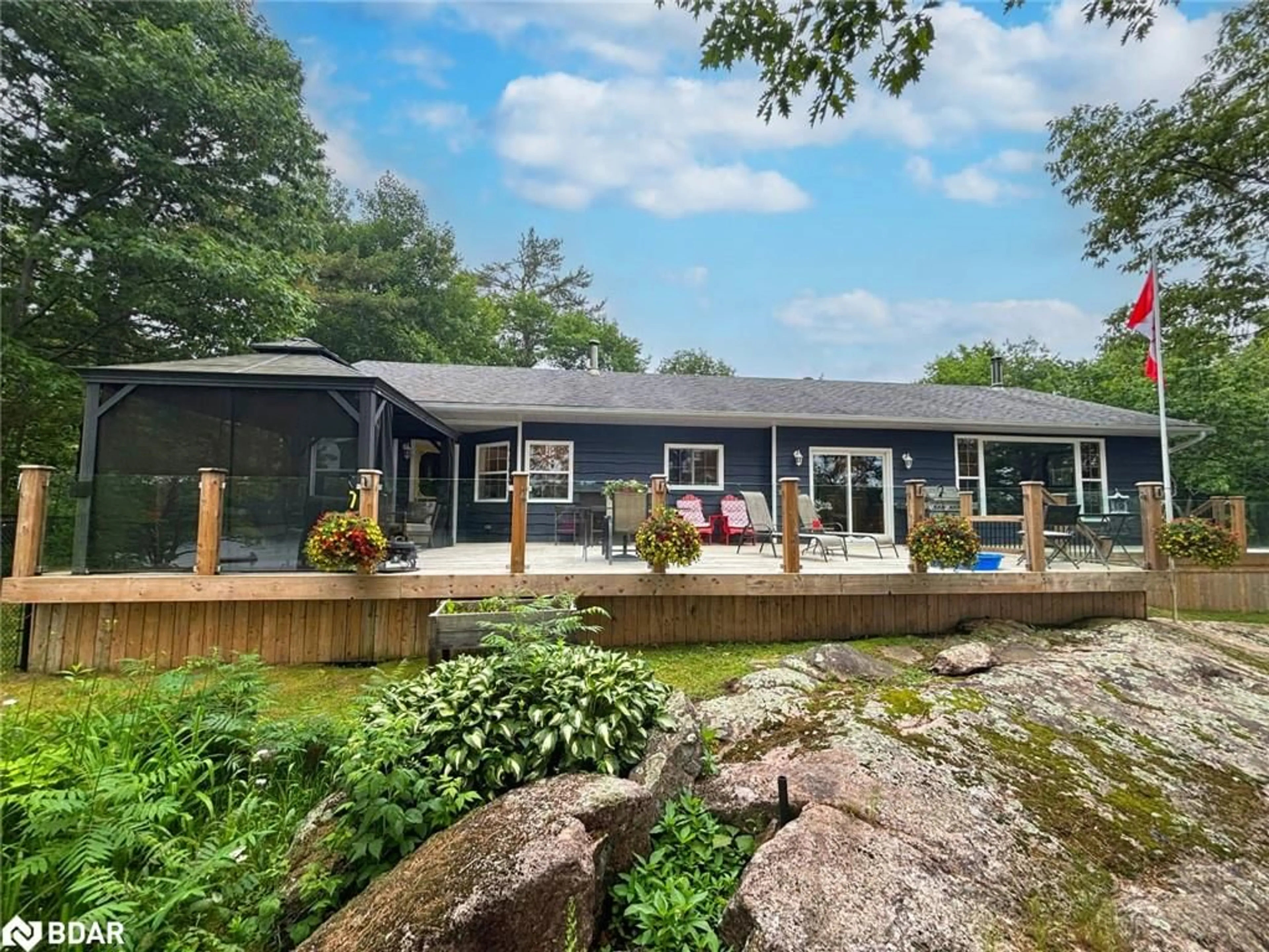 A pic from outside/outdoor area/front of a property/back of a property/a pic from drone, water/lake/river/ocean view for 1008 Cove Rd, Gravenhurst Ontario P0E 1G0