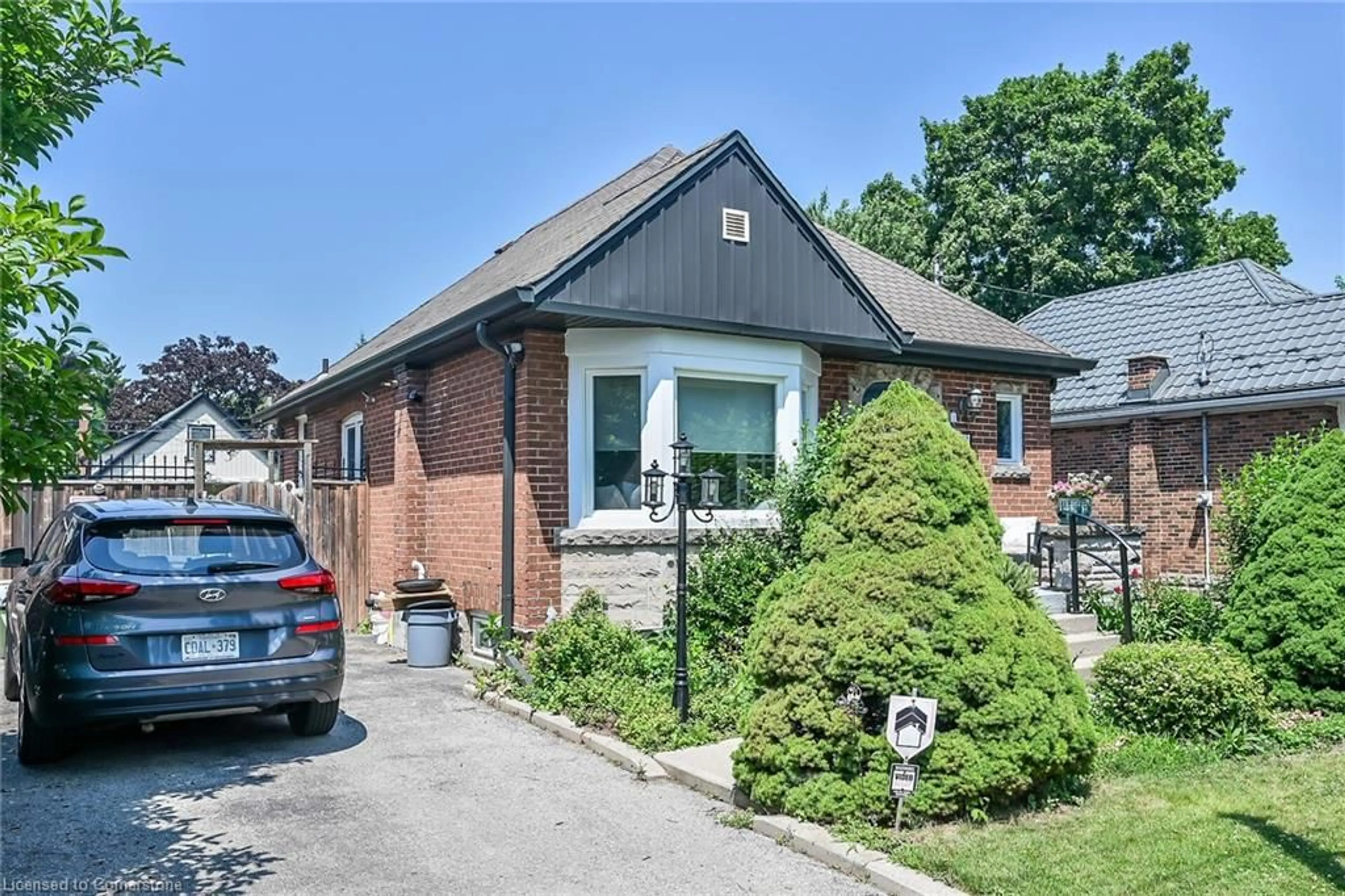Home with brick exterior material, street for 118 East 6th St, Hamilton Ontario L9A 3C2