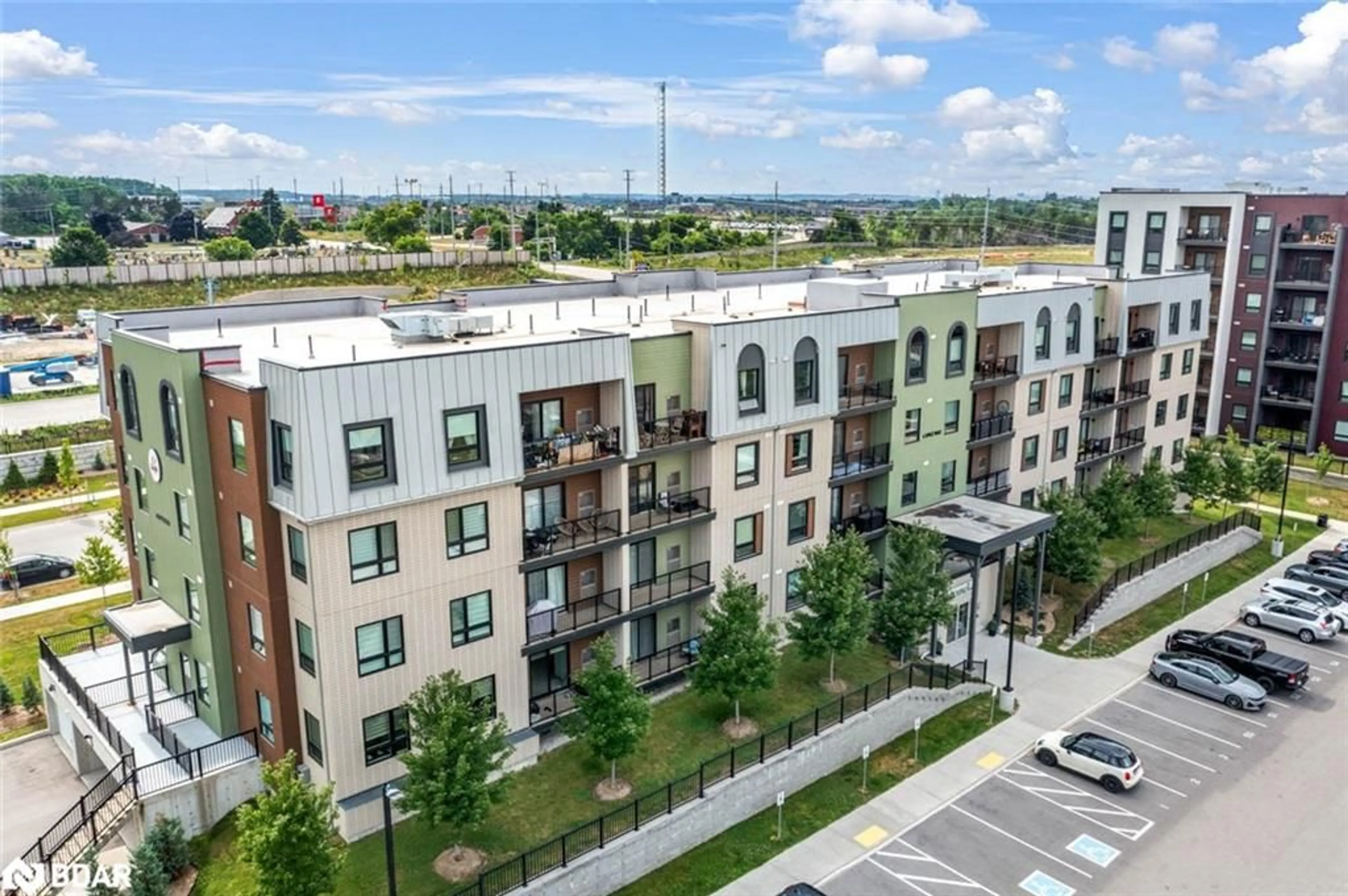 A pic from outside/outdoor area/front of a property/back of a property/a pic from drone, city buildings view from balcony for 6 Spice Way #312, Barrie Ontario L9J 0J9