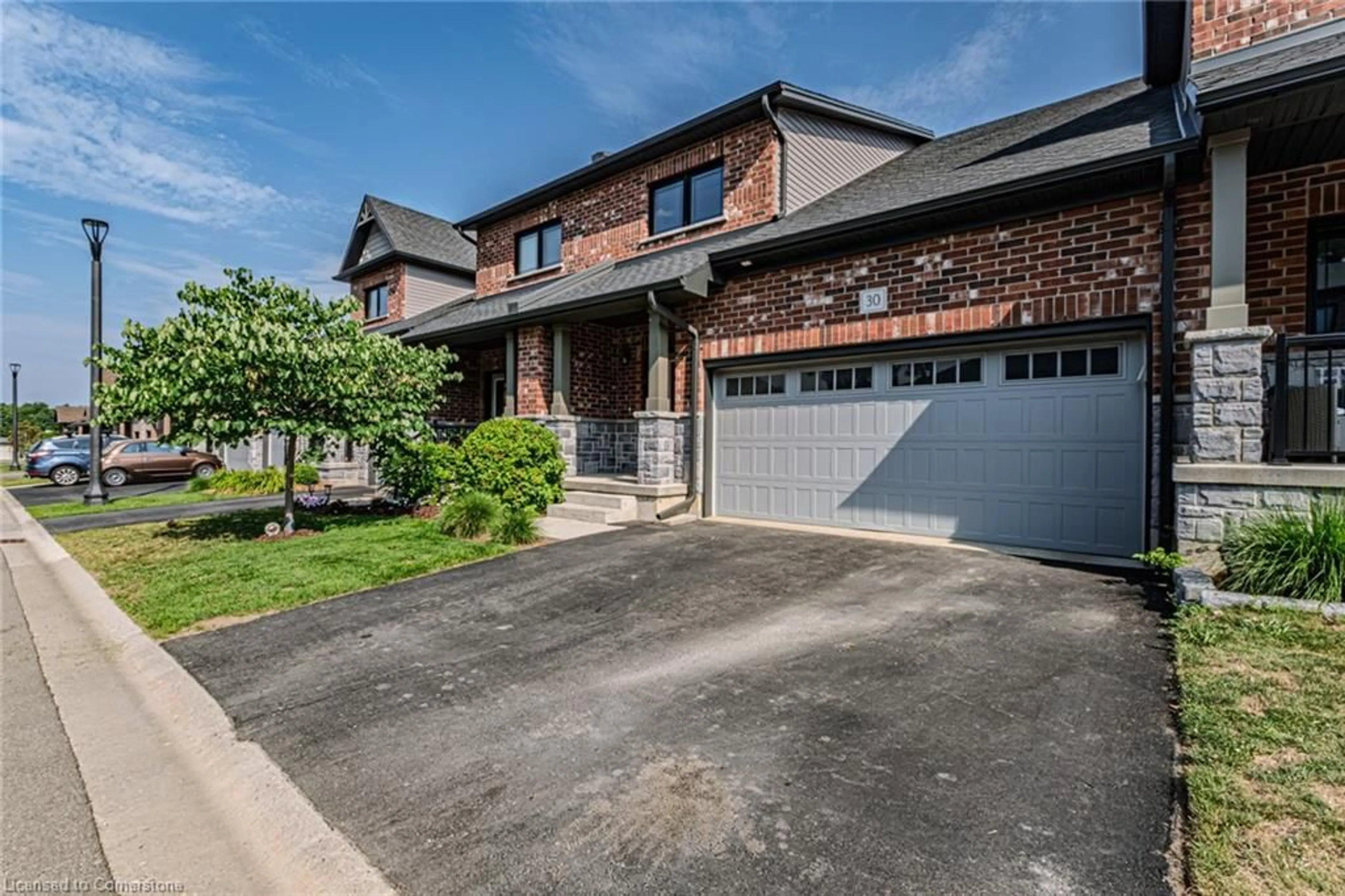 Home with brick exterior material, street for 30 Serviceberry Lane #34, Simcoe Ontario N3Y 0E7