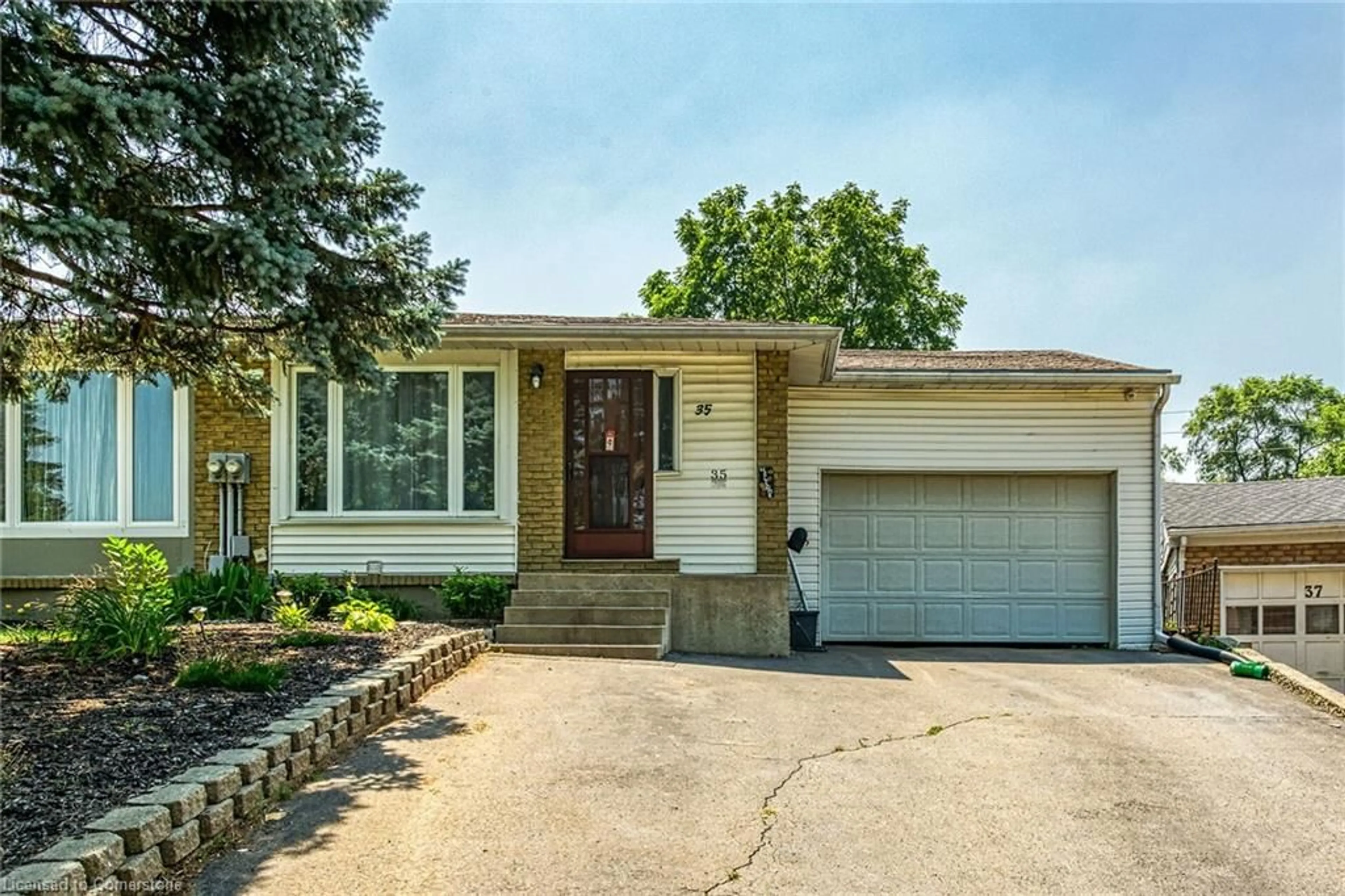 Home with brick exterior material, street for 35 Woodlawn Ave, Brantford Ontario N3V 1A6