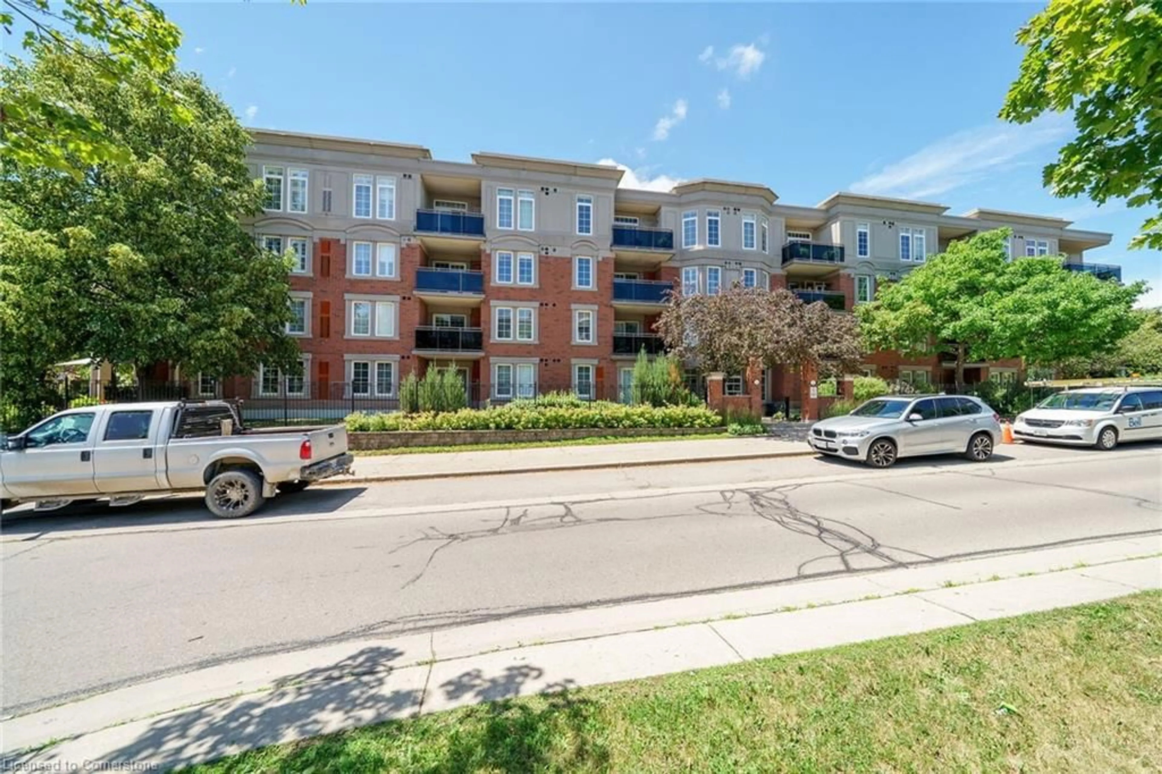 A pic from outside/outdoor area/front of a property/back of a property/a pic from drone, street for 2300 Parkhaven Blvd #407, Oakville Ontario L6H 6V9