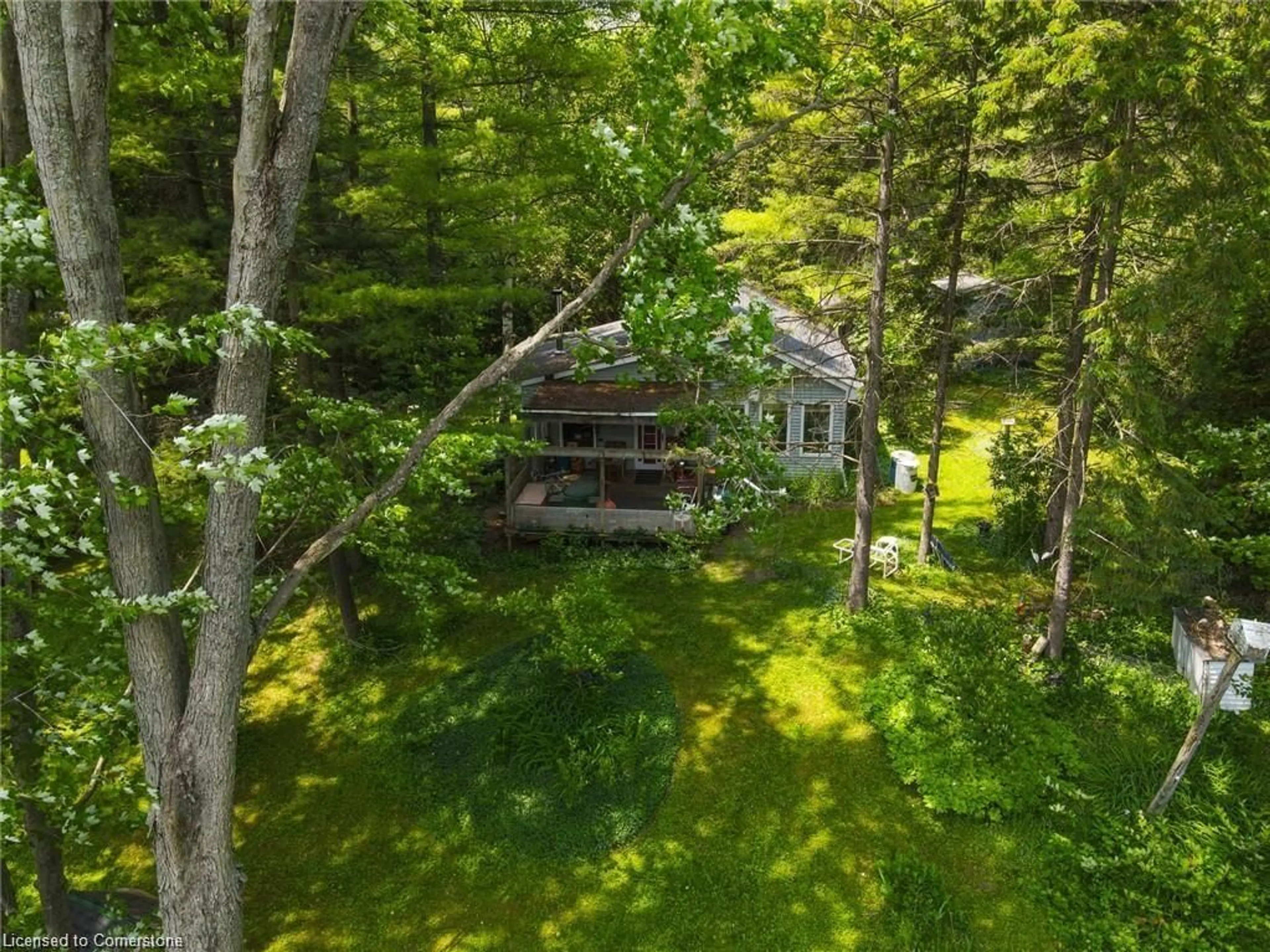 A pic from outside/outdoor area/front of a property/back of a property/a pic from drone, forest/trees view for 1002 Tenth St, Belwood Ontario N0B 1J0