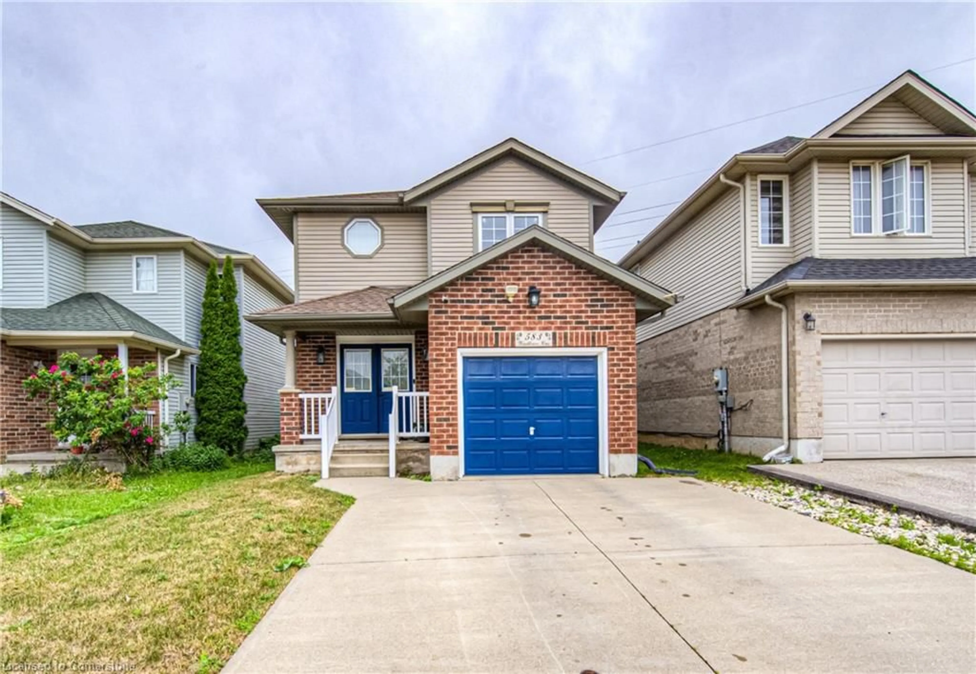 Home with brick exterior material, street for 583 Windflower Cres, Kitchener Ontario N2E 4E3