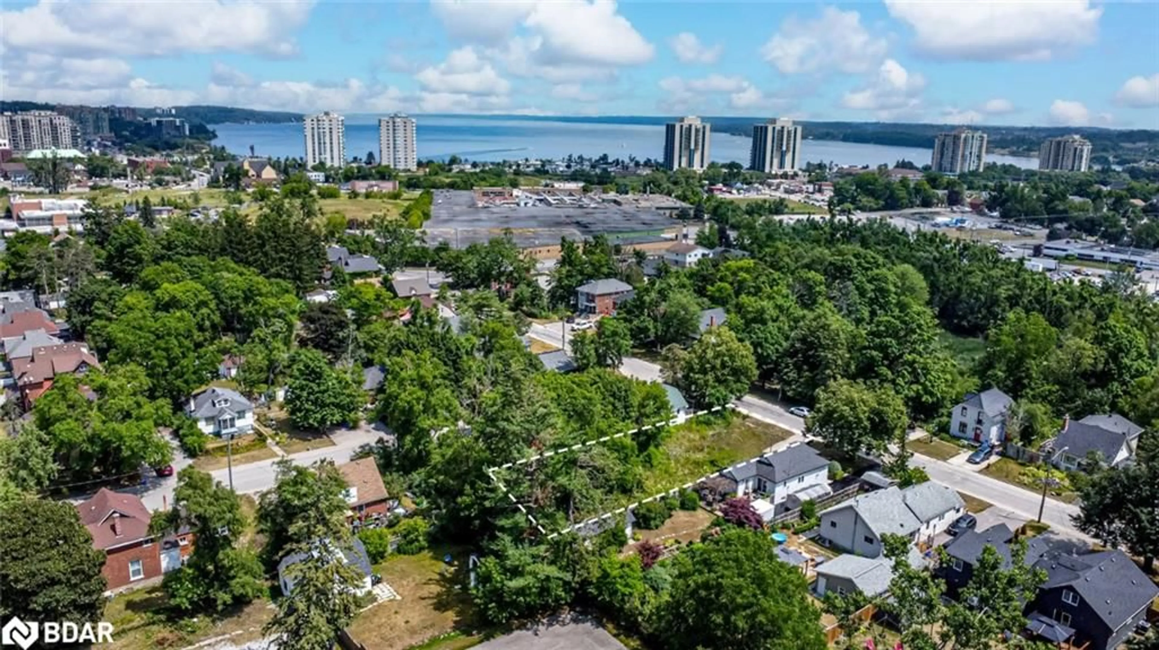 A pic from outside/outdoor area/front of a property/back of a property/a pic from drone, water/lake/river/ocean view for 40 Perry St, Barrie Ontario L4N 2G3