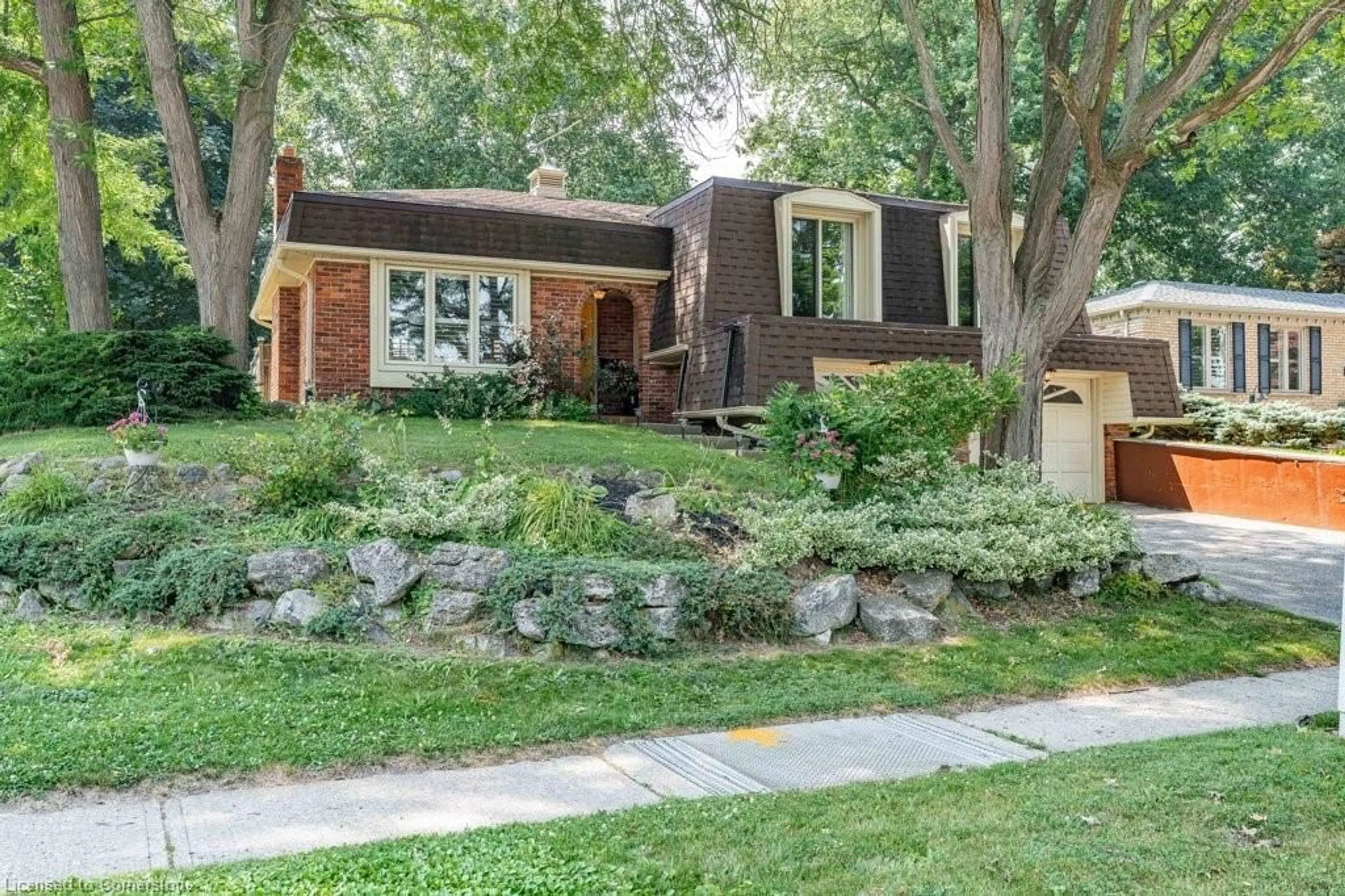 Home with brick exterior material, street for 44 Cedarland Dr, Brantford Ontario N3R 6N7