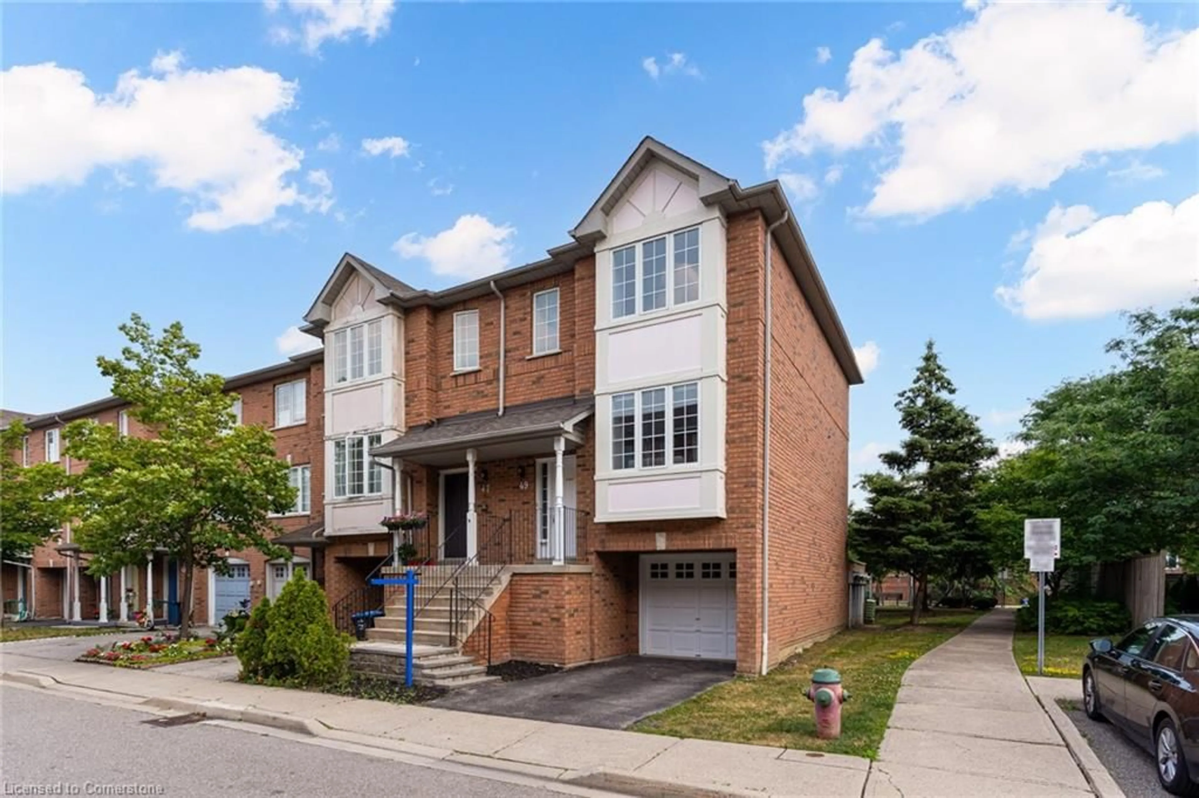Home with brick exterior material, street for 80 Acorn Pl #49, Mississauga Ontario L4Z 4E1
