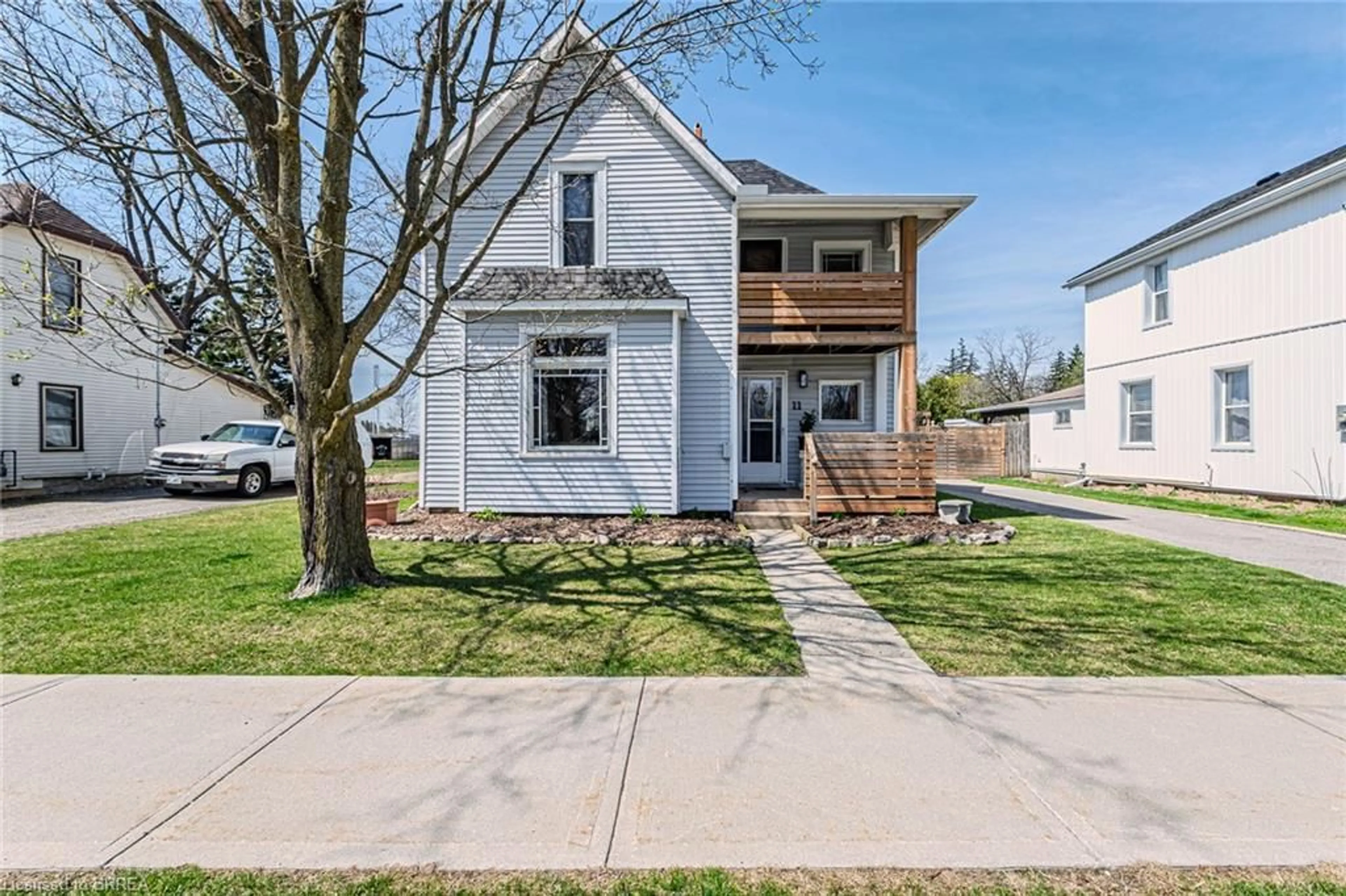 Home with vinyl exterior material, street for 11 Alexander St, Burford Ontario N0E 1A0