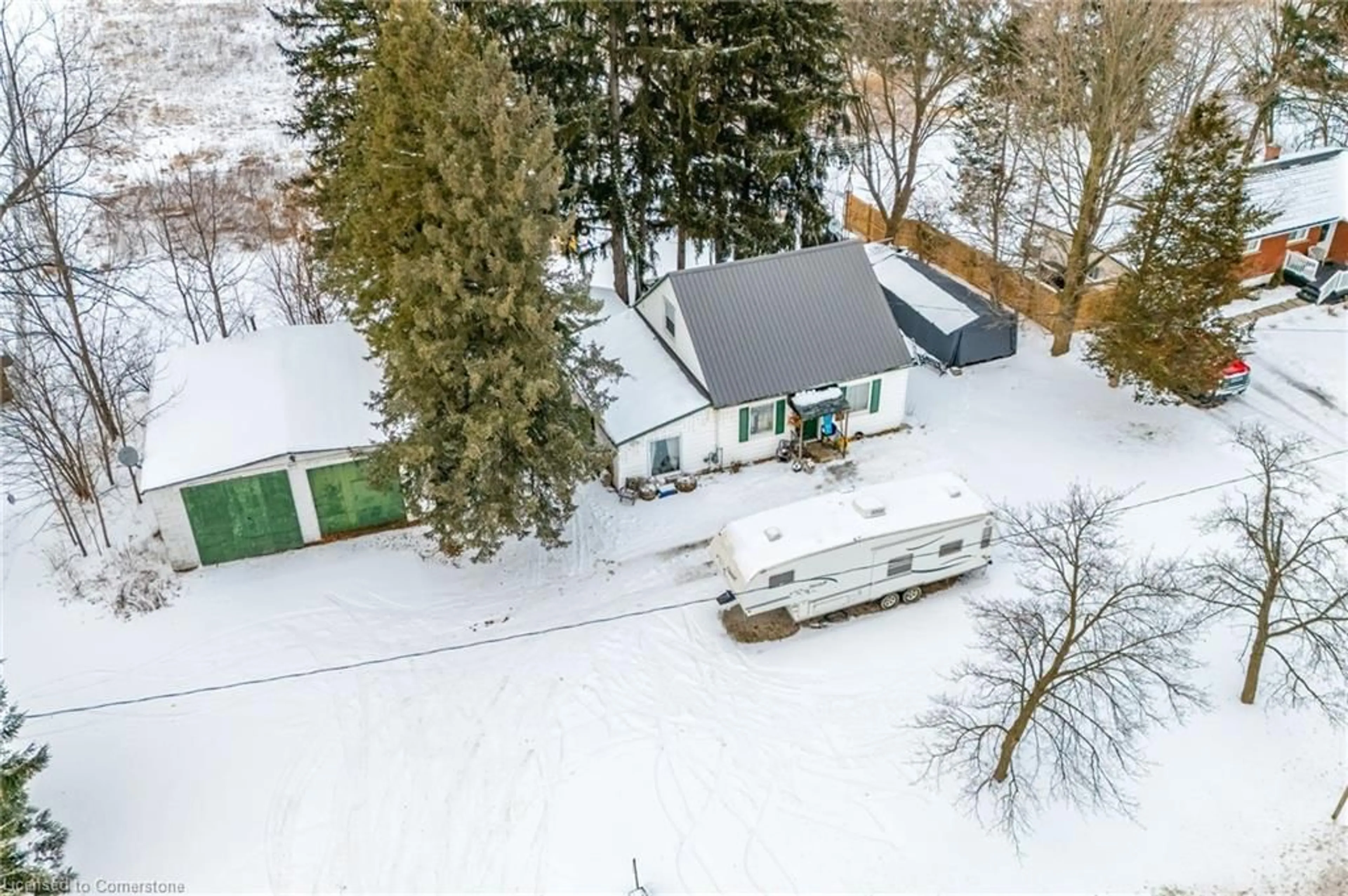 A pic from outside/outdoor area/front of a property/back of a property/a pic from drone, street for 211 Thompson Rd West Rd, Waterford Ontario N0E 1Y0