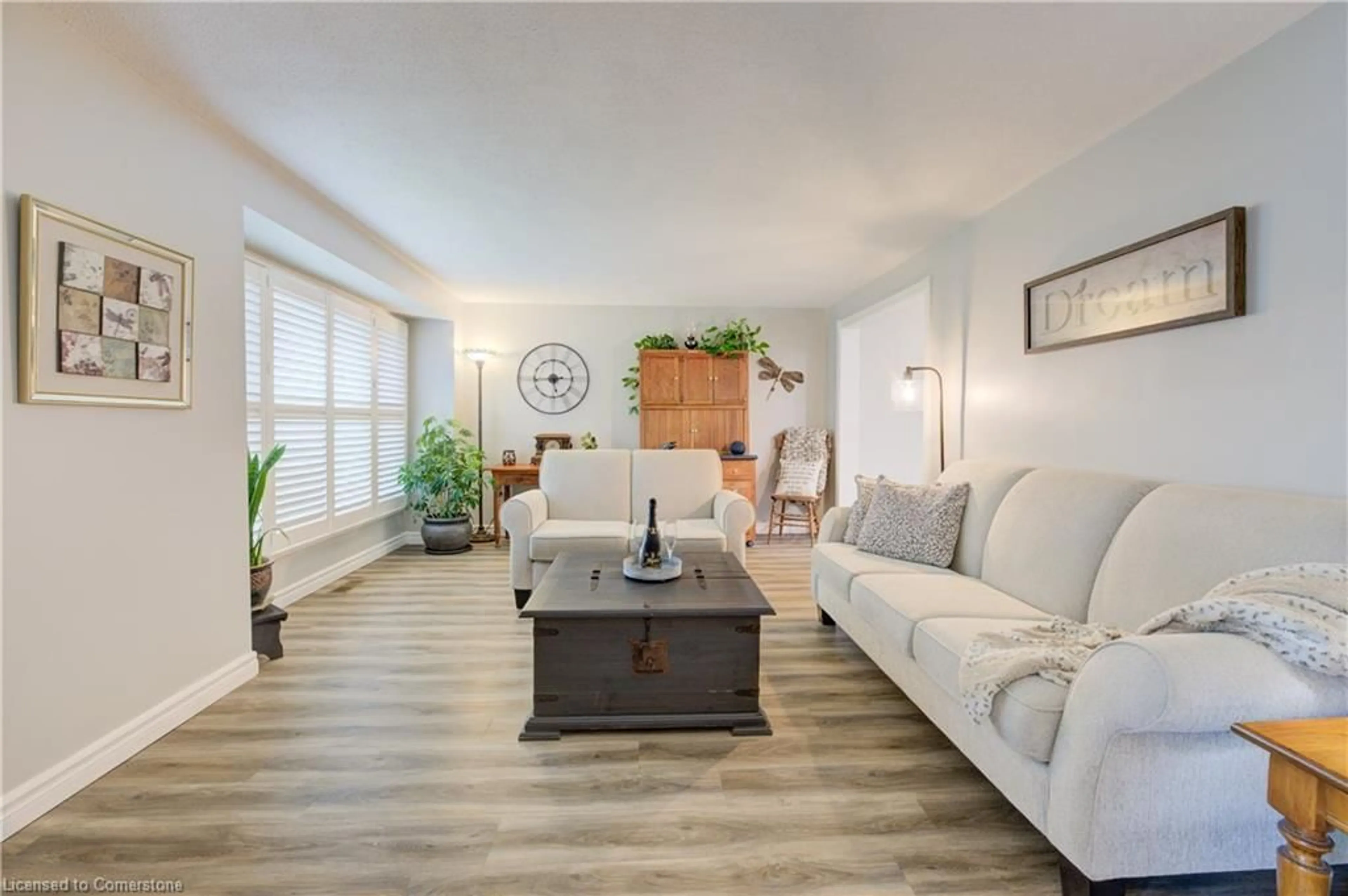 Living room with furniture, wood/laminate floor for 96 Manor Dr, Kitchener Ontario N2A 2V1