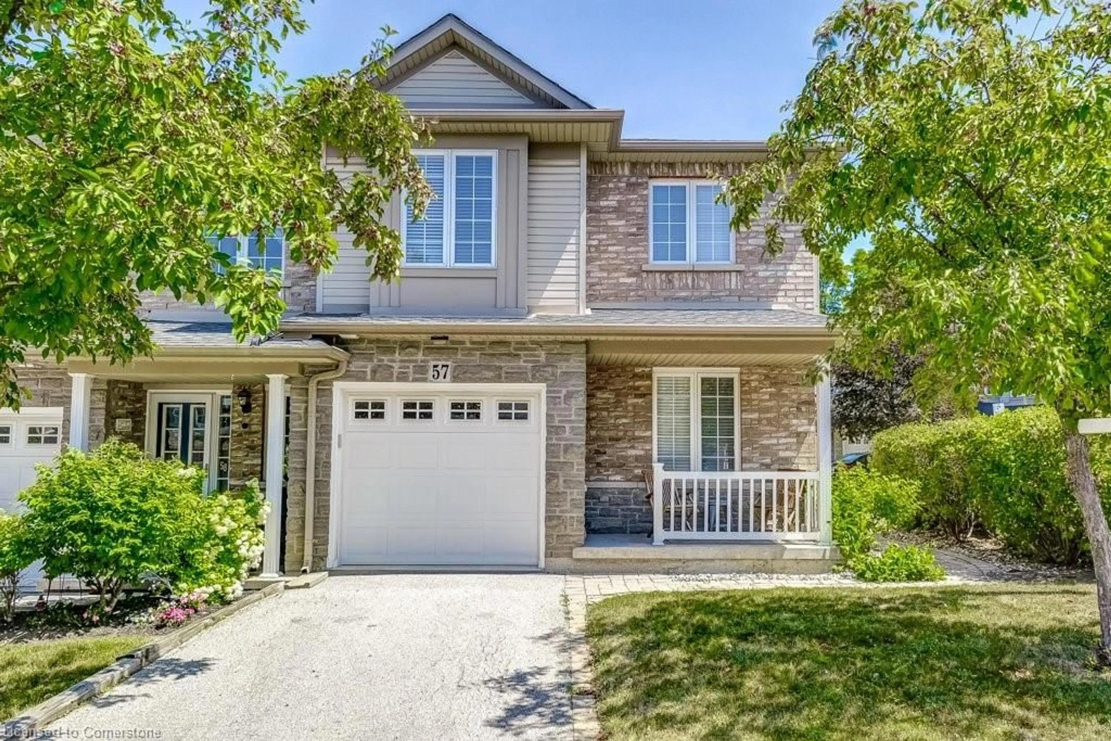 Home with brick exterior material, street for 7 Southside Pl #57, Hamilton Ontario L9C 7W6