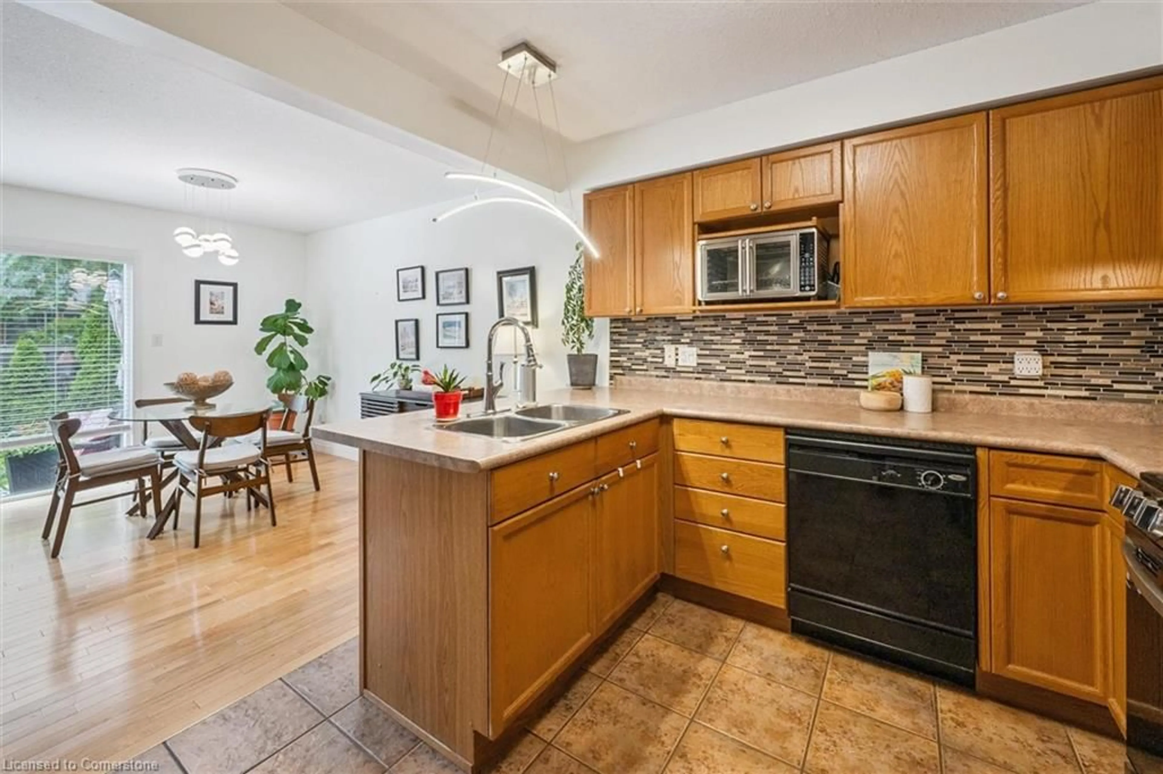 Open concept kitchen, ceramic/tile floor for 31 Schroder Cres #24, Guelph Ontario N1E 7M6