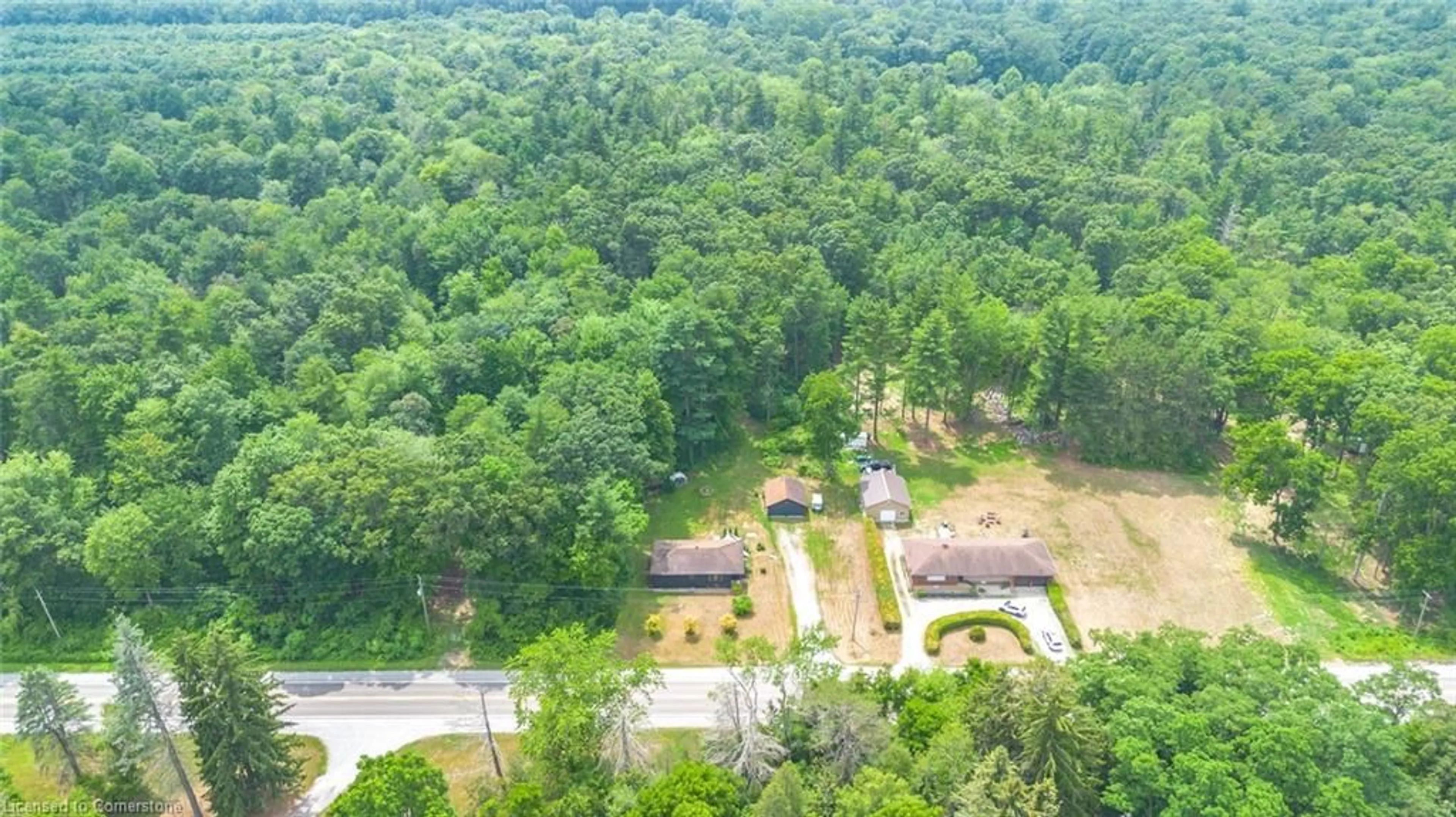 A pic from outside/outdoor area/front of a property/back of a property/a pic from drone, forest/trees view for 555 Turkeypoint Rd, Vittoria Ontario N0E 1W0