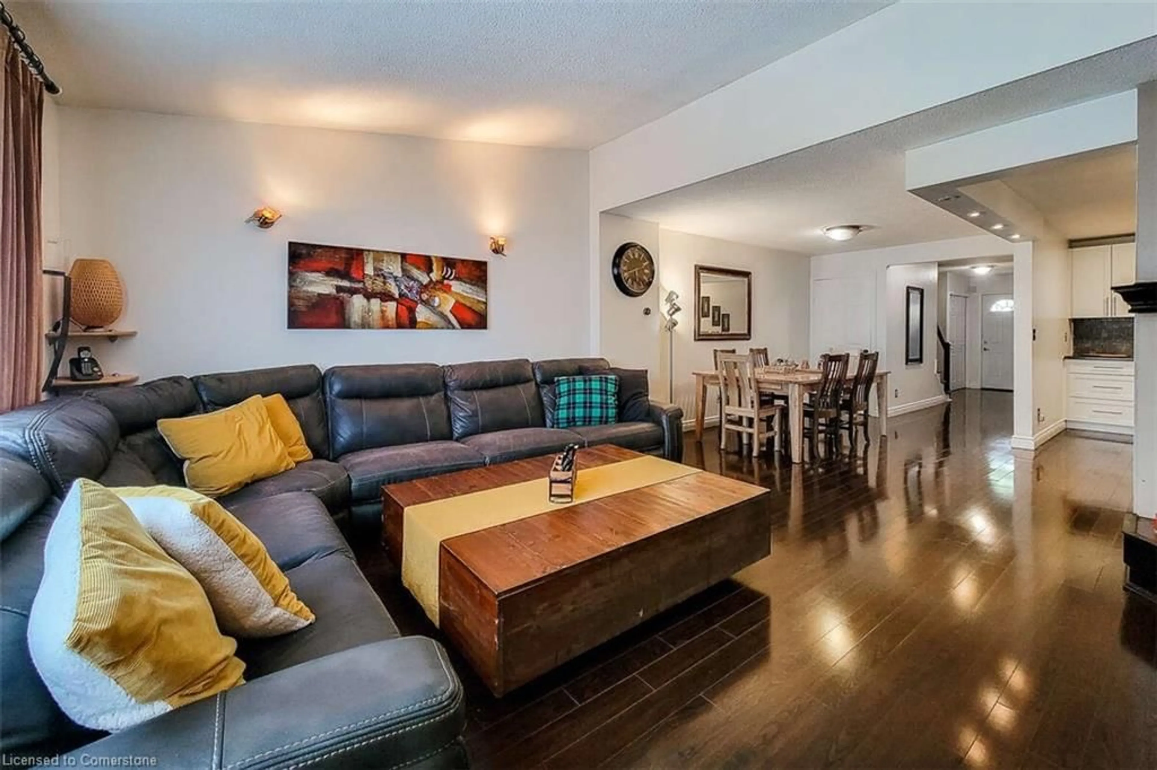 Living room with furniture, wood/laminate floor for 339 Macintosh Dr, Stoney Creek Ontario L8E 4E1