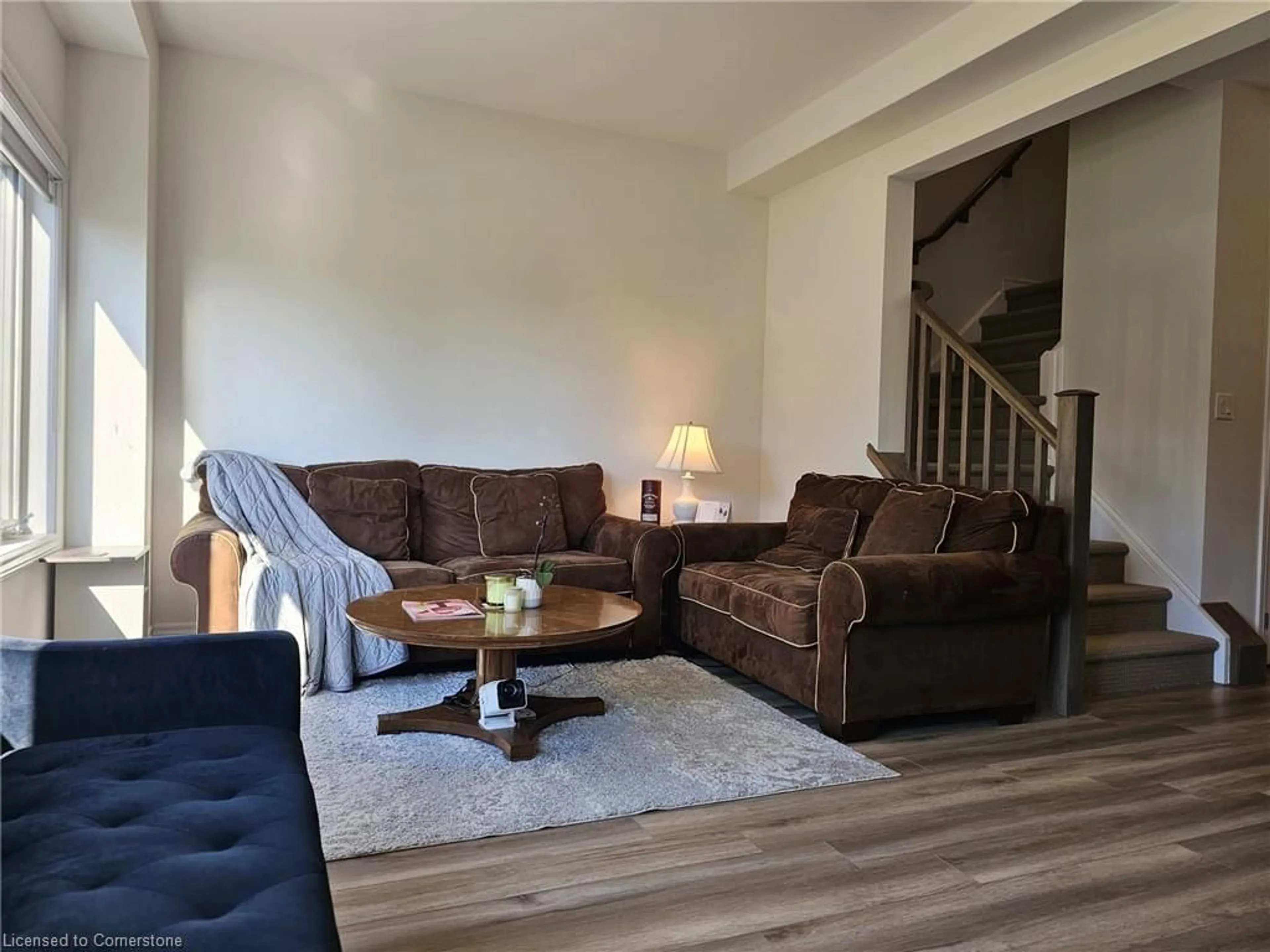 Living room with furniture, wood/laminate floor for 290 Equestrian Way #58, Cambridge Ontario N3E 0E7