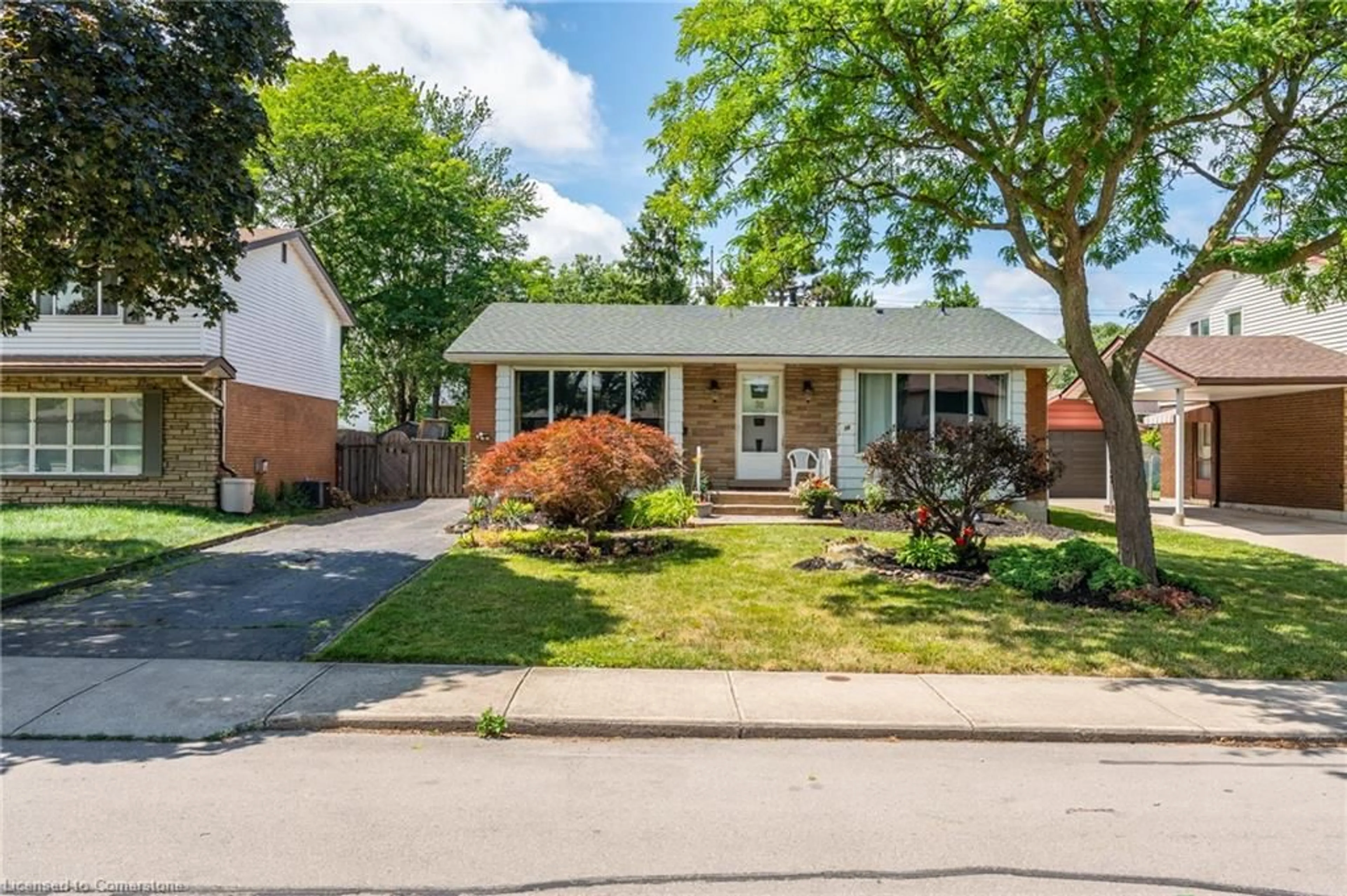 Home with brick exterior material, street for 38 Goldfinch Rd, Hamilton Ontario L9A 3W7